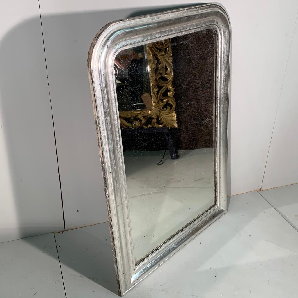 Very decorative French c19th Louis Philippe overmantle mirror with the original rare silver gilt frame and also has its original mirror glass too.
Great mirror, would hang as a mantle mirror, but at this size it would also work well above a console