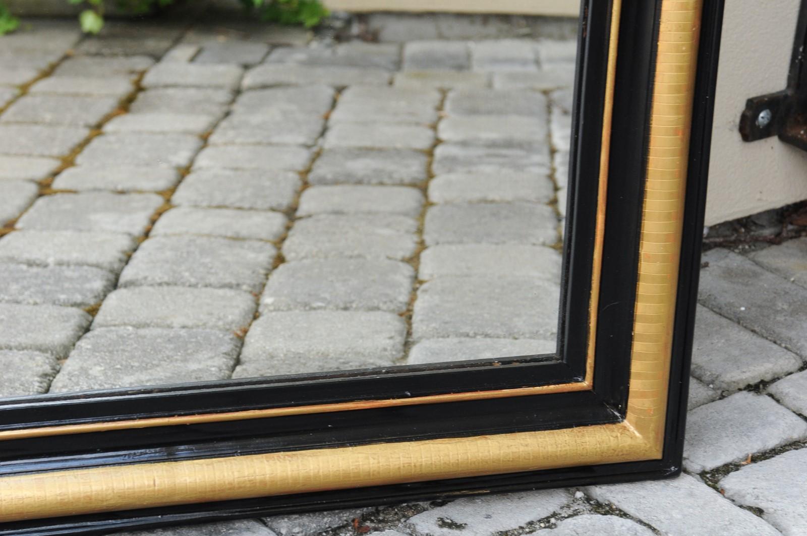 Wood French Louis-Philippe Style Mirror with Ebonized Frame and Gilt Accents, 1900s For Sale