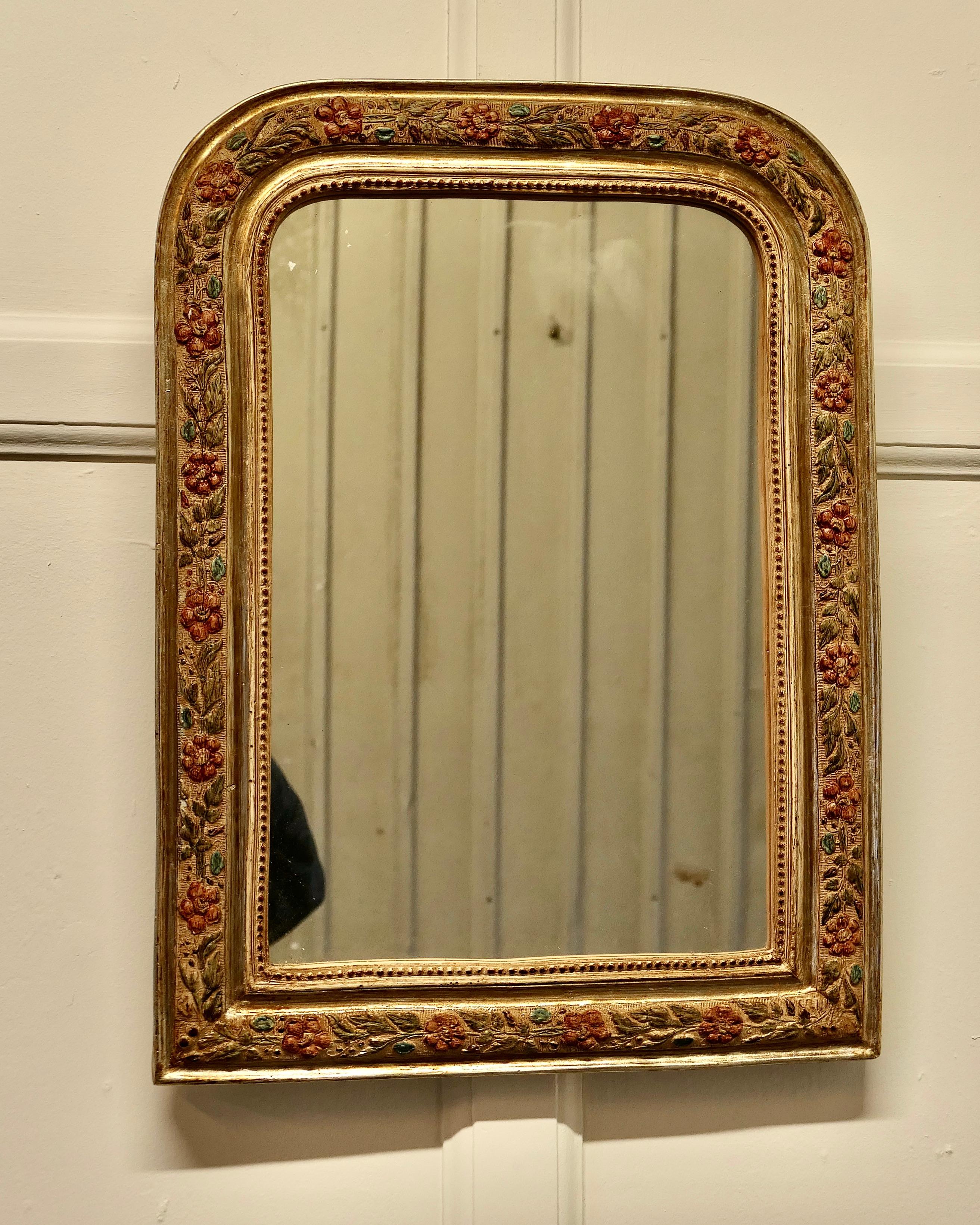 French Louis Philippe Style Painted Gilt mirror

This is a very attractive Wall Mirror an excellent example of French antique chic furnishing, the 3” mirror frame is very ornate, decorated with leaves and flowers which are painted in traditional