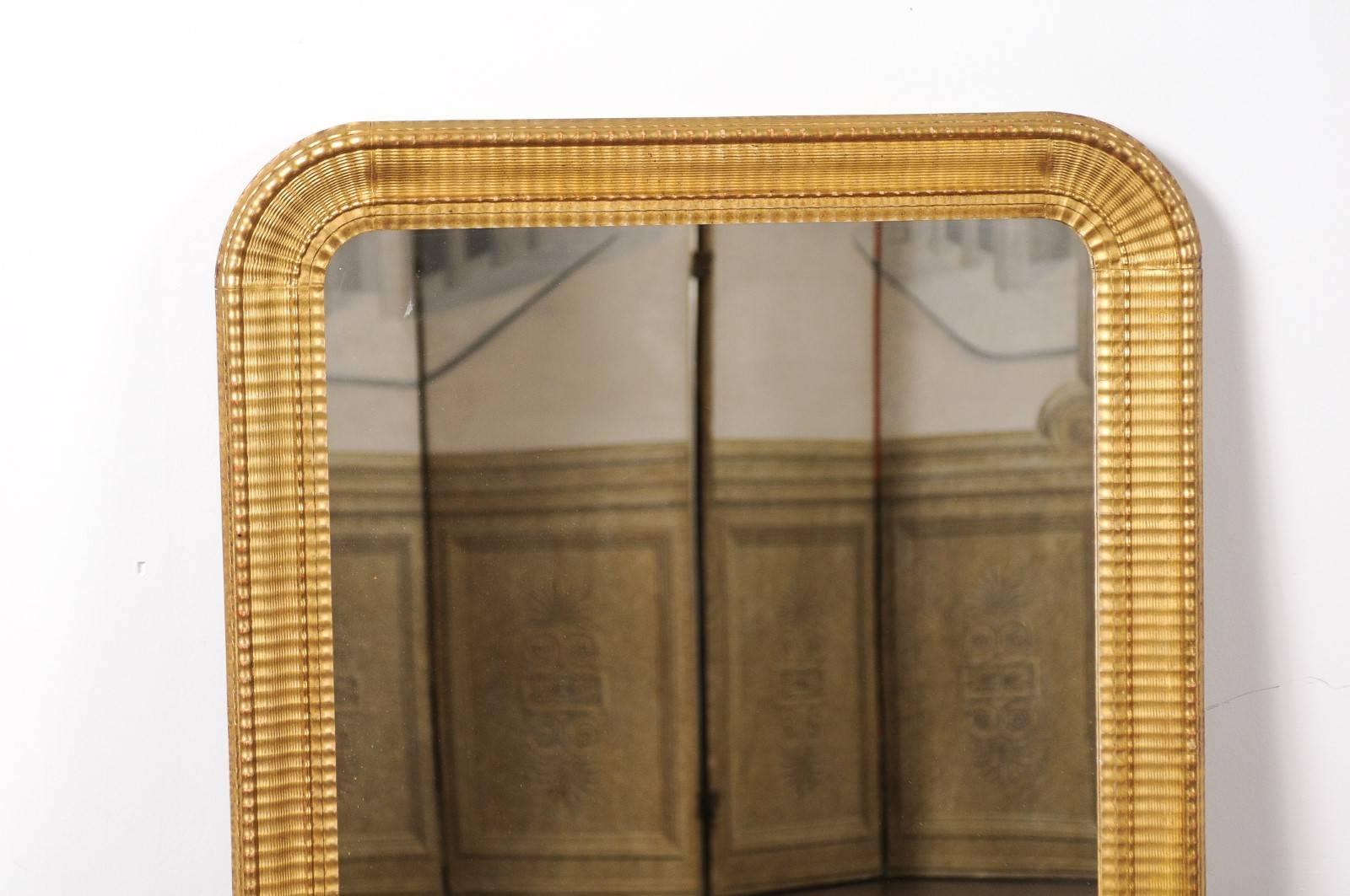 Louis Philippe French Louis-Philippe Style Ridged Giltwood Mirror from the Early 20th Century