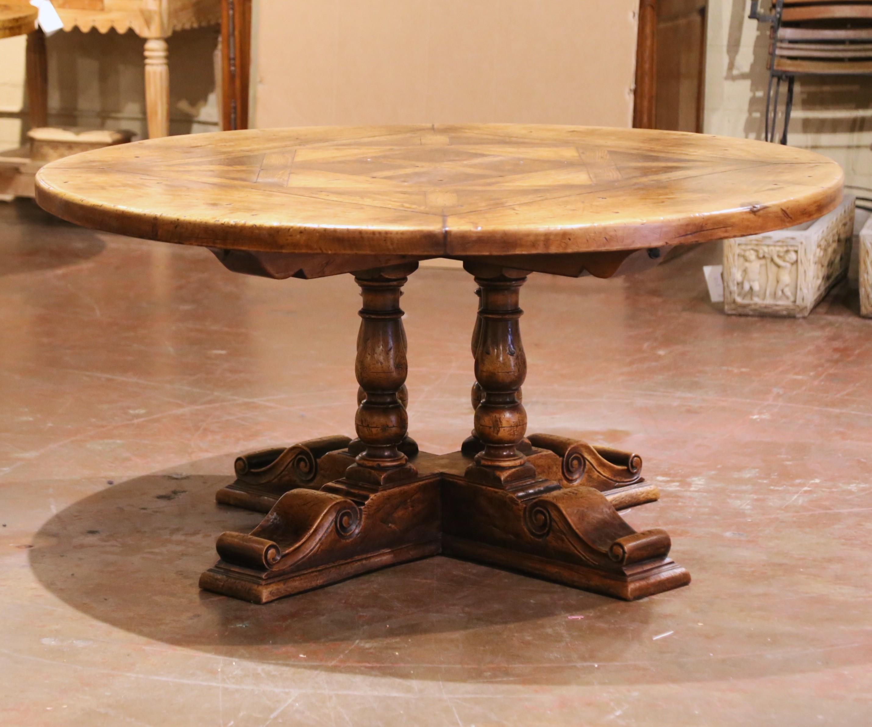 Crafted in the French Pyrenees using 18th-century walnut and other mixed hardwoods including chestnut and oak, this elegant round table embodies the robust character and geometric discipline of the Louis XIII style. Measuring 62.25 inches in