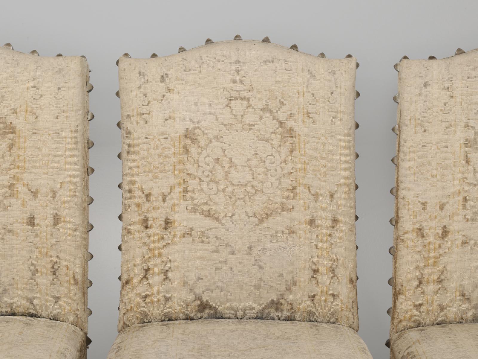 Not very often do we come across a set of époque Louis XIII style dining chairs that date from the 1700’s, let alone a set of (8). Each chair is slightly different and none are perfectly plumb. The chenille fabric is so old, that most of it has been