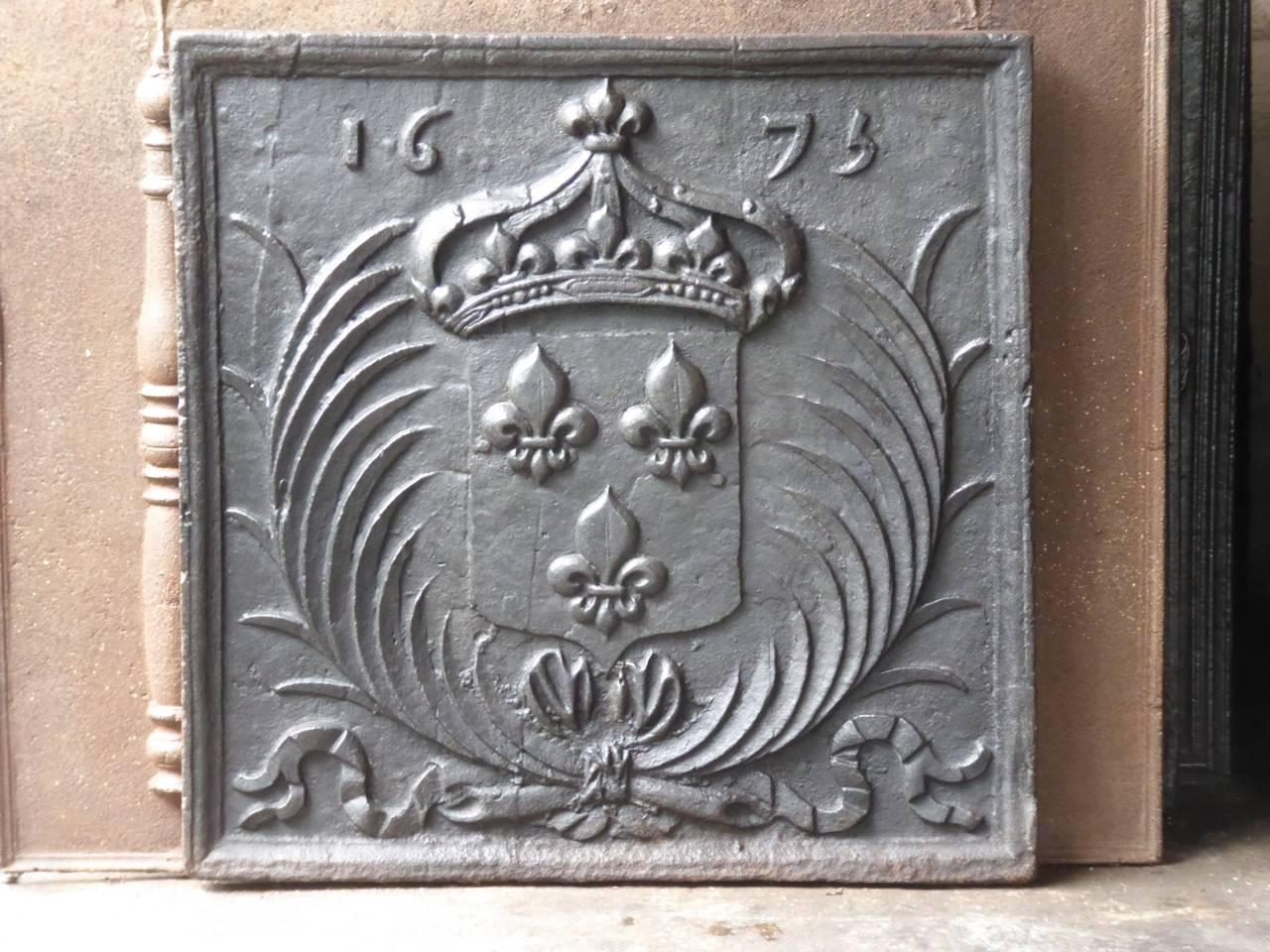 17th century French fireback with the arms of France. The fireback is cast in 1675. Coat of arms of the House of Bourbon, an originally French royal house that became a major dynasty in Europe. It delivered kings for Spain (Navarra), France, both