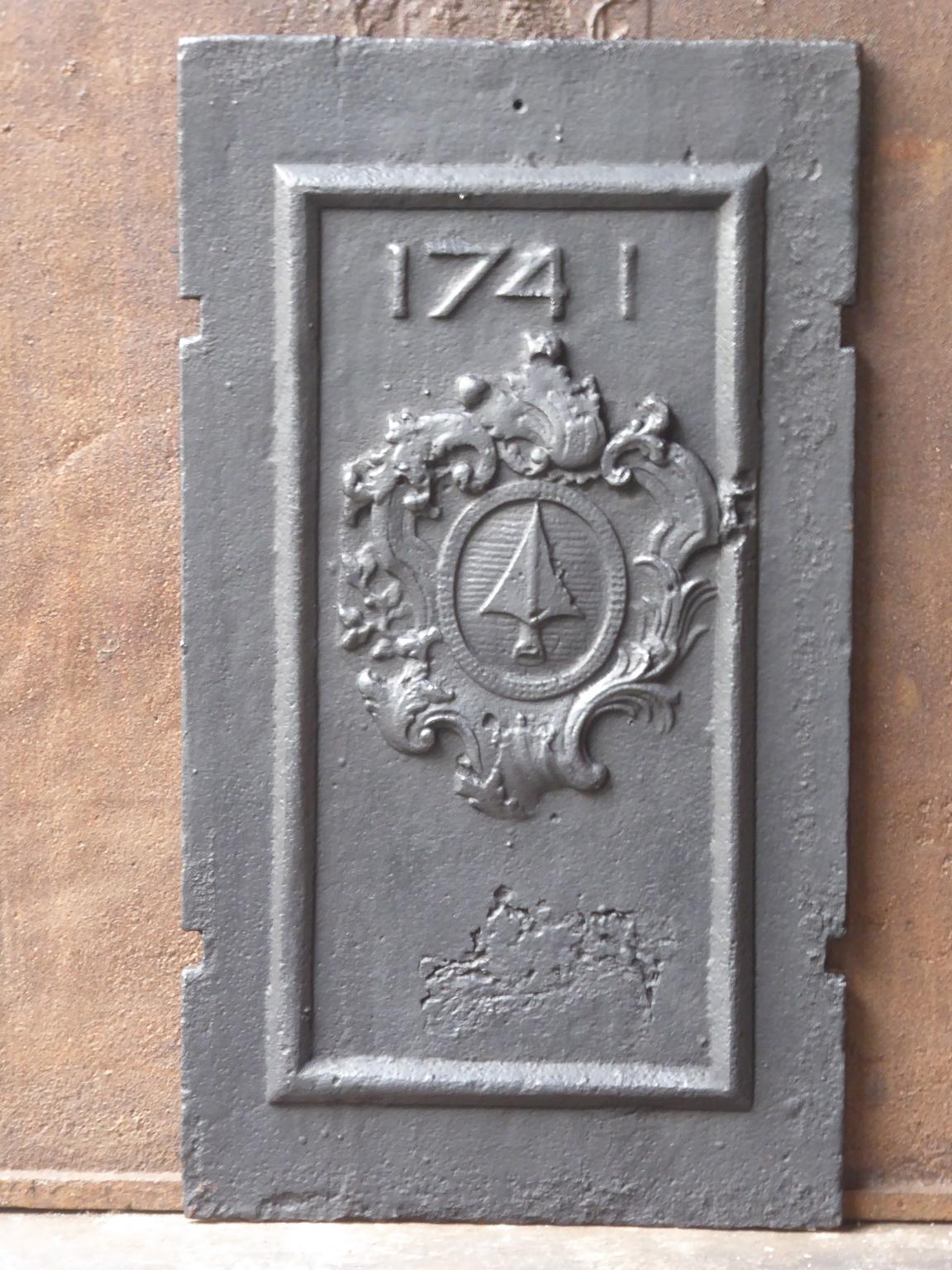 18th century French Louis XIV fireback with a coat of arms and 1741, its year of production. The fireback is made of cast iron. The condition is good.









 