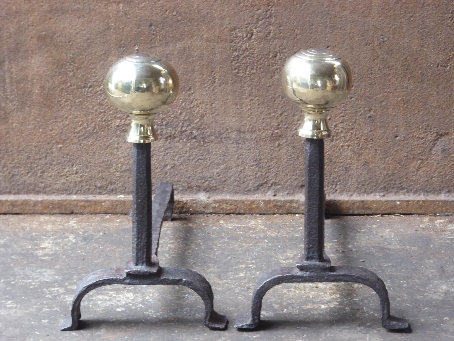 17th-18th century French Louis XIV andirons. The andirons are made of wrought iron with polished bronze knobs. They are in a good condition and fit for use in the fireplace.















 
