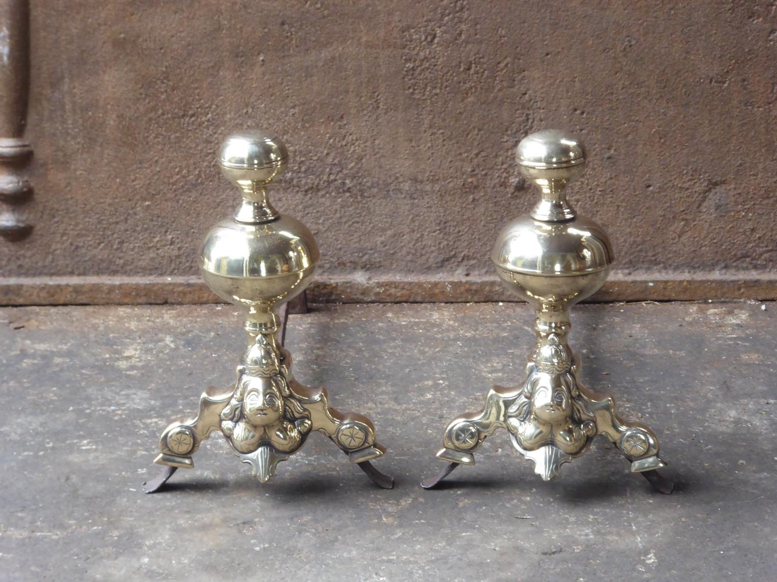 Beautiful 17th century French Louis XIV andirons. The andirons are made of polished bronze and wrought iron. They have the typical Louis XIV design which was popular during that period.















 