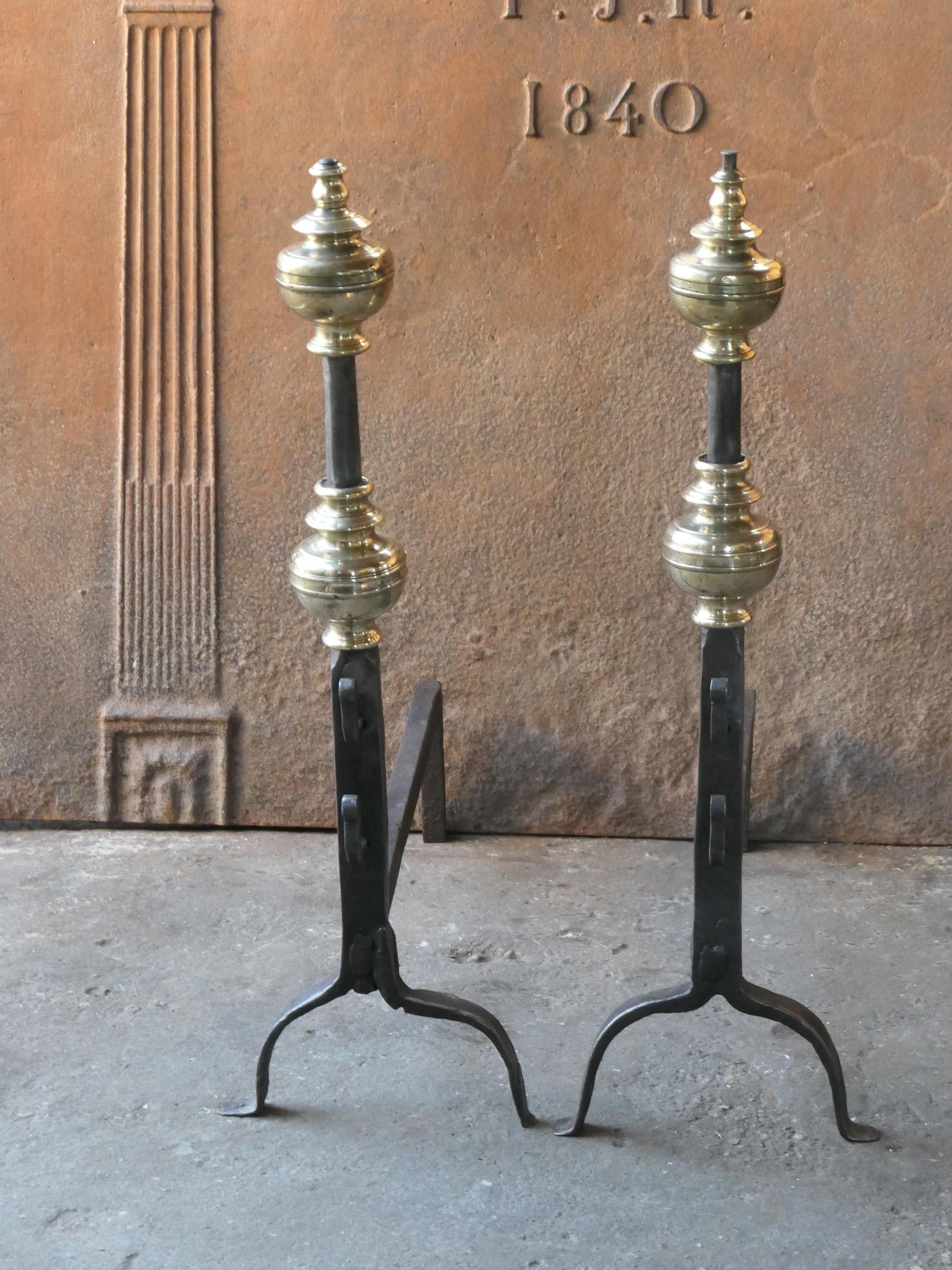 Beautiful 17th century French Louis XIV period andirons. They are hand forged and made of wrought iron and polished brass. The top of the andiron at the right in the pictures has been damaged slightly. The andirons are fully functional. 






