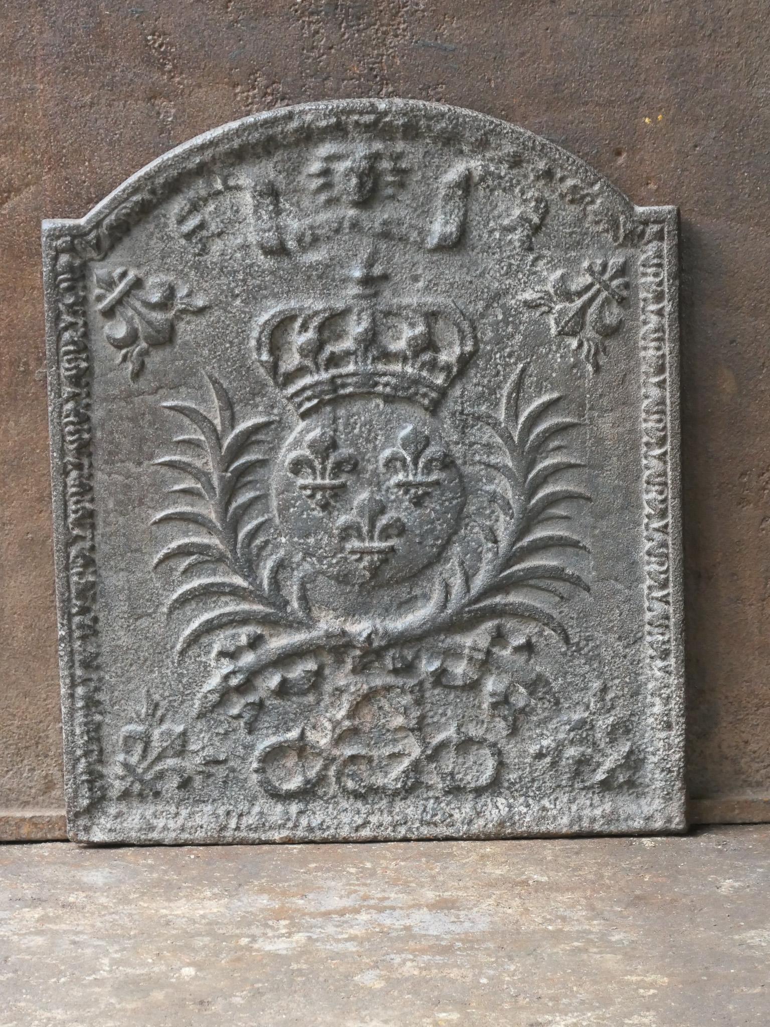 18th century French Louis XIV period fireback with the Arms of France. A coat of arms of the House of Bourbon, an originally French royal house that became a major dynasty in Europe. The house delivered kings for Spain (Navarra), France, both