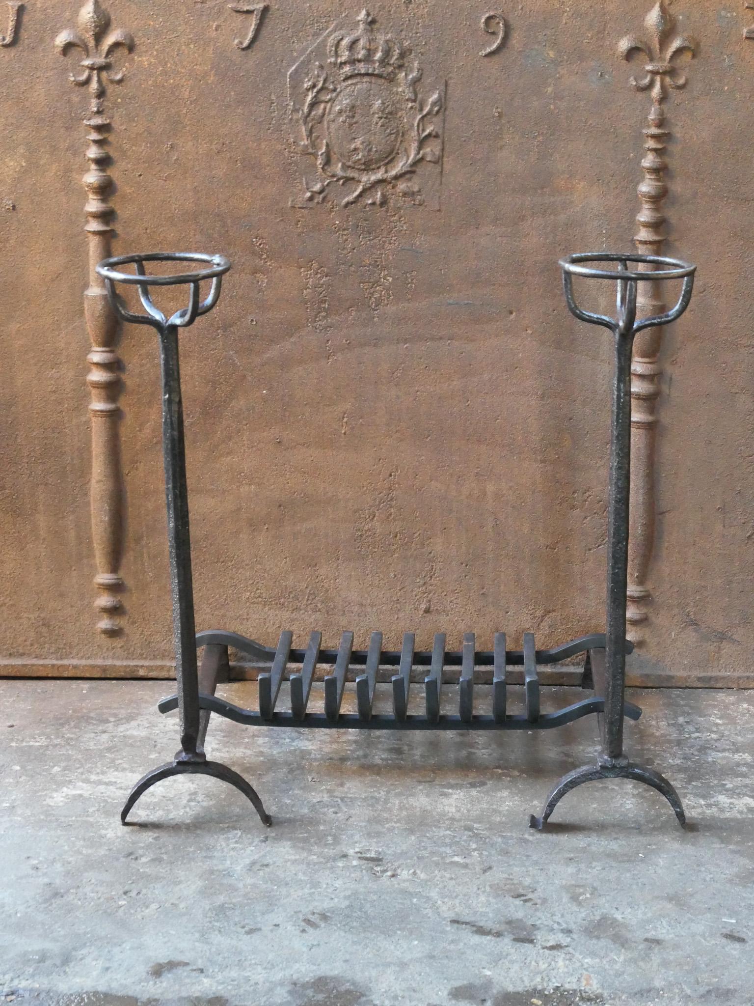 17th century French Louis XIV period andirons, also called cupdogs, with a newly forged grate. With a cup to keep drinks or soup warm. The condition is good.






  