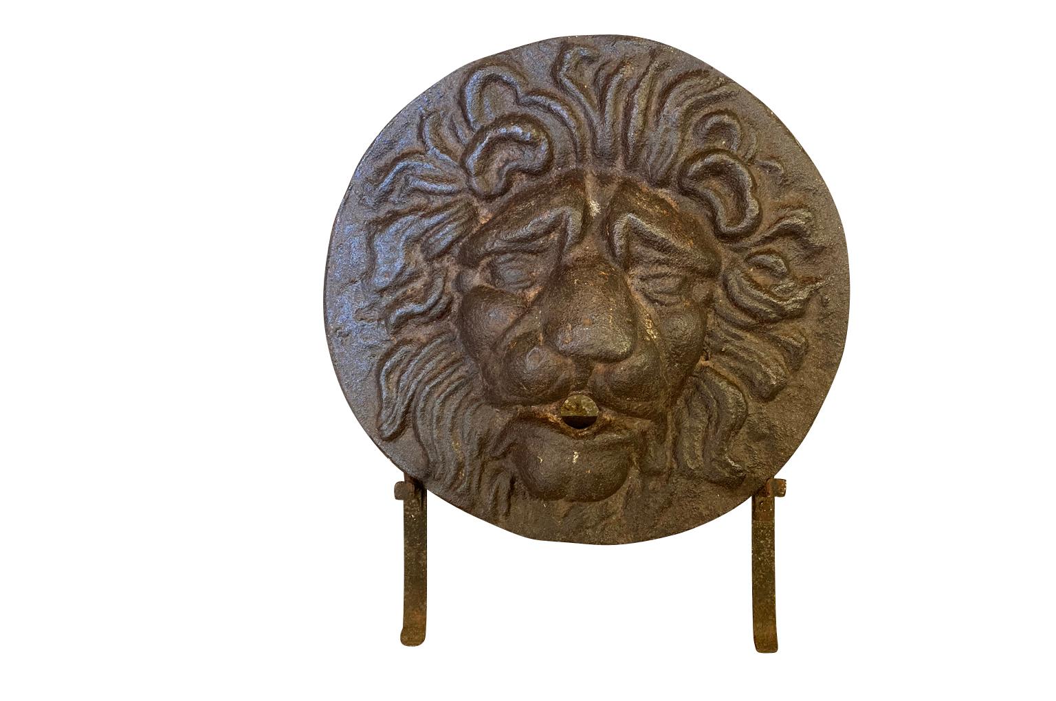 A very stunning 17th century - Louis XIV period Fountain Head - in the form of a lion. Beautifully crafted in cast iron - now resting on its stand. A striking accent piece for any bookcase or table top or again used as a fountain head. The diameter