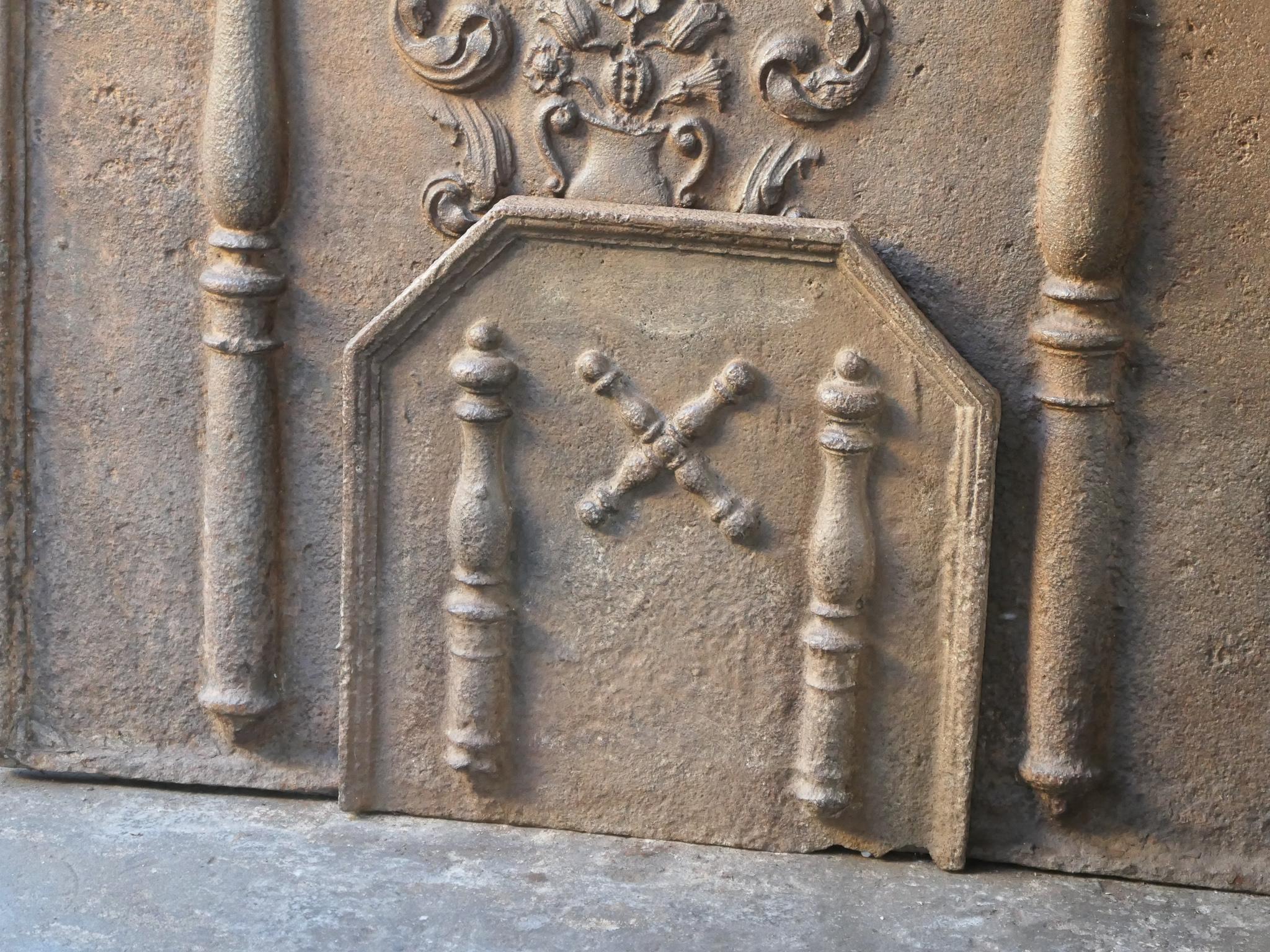 18th century French fireback with a Saint Andrew's cross and two pillars of Hercules. Saint Andrew is said to have been martyred on a cross in this shape. The cross is since then a sign for humility and sacrifice. The pillars of Hercules symbolize