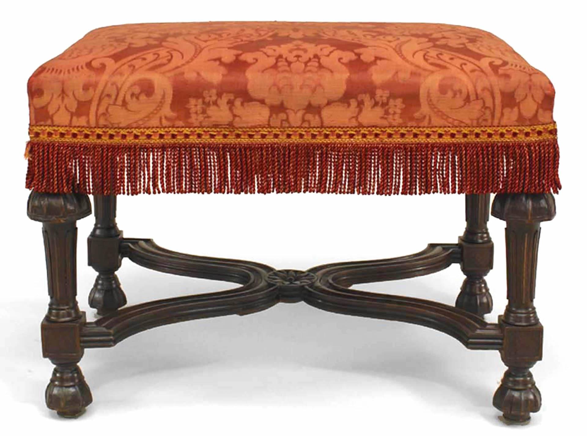 French Louis XIV style (19th century) stained oak rectangular bench with stretcher and red fringe upholstery.
  