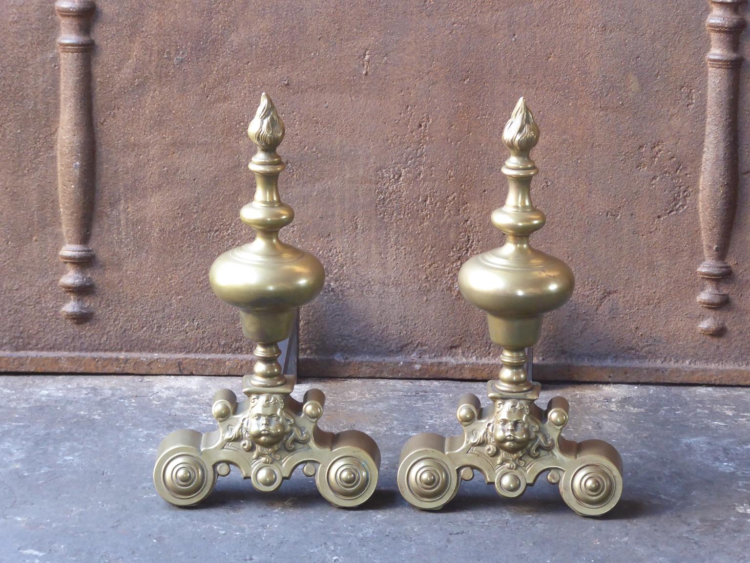 20th century French Louis XIV style andirons made of brass and wrought iron.







 