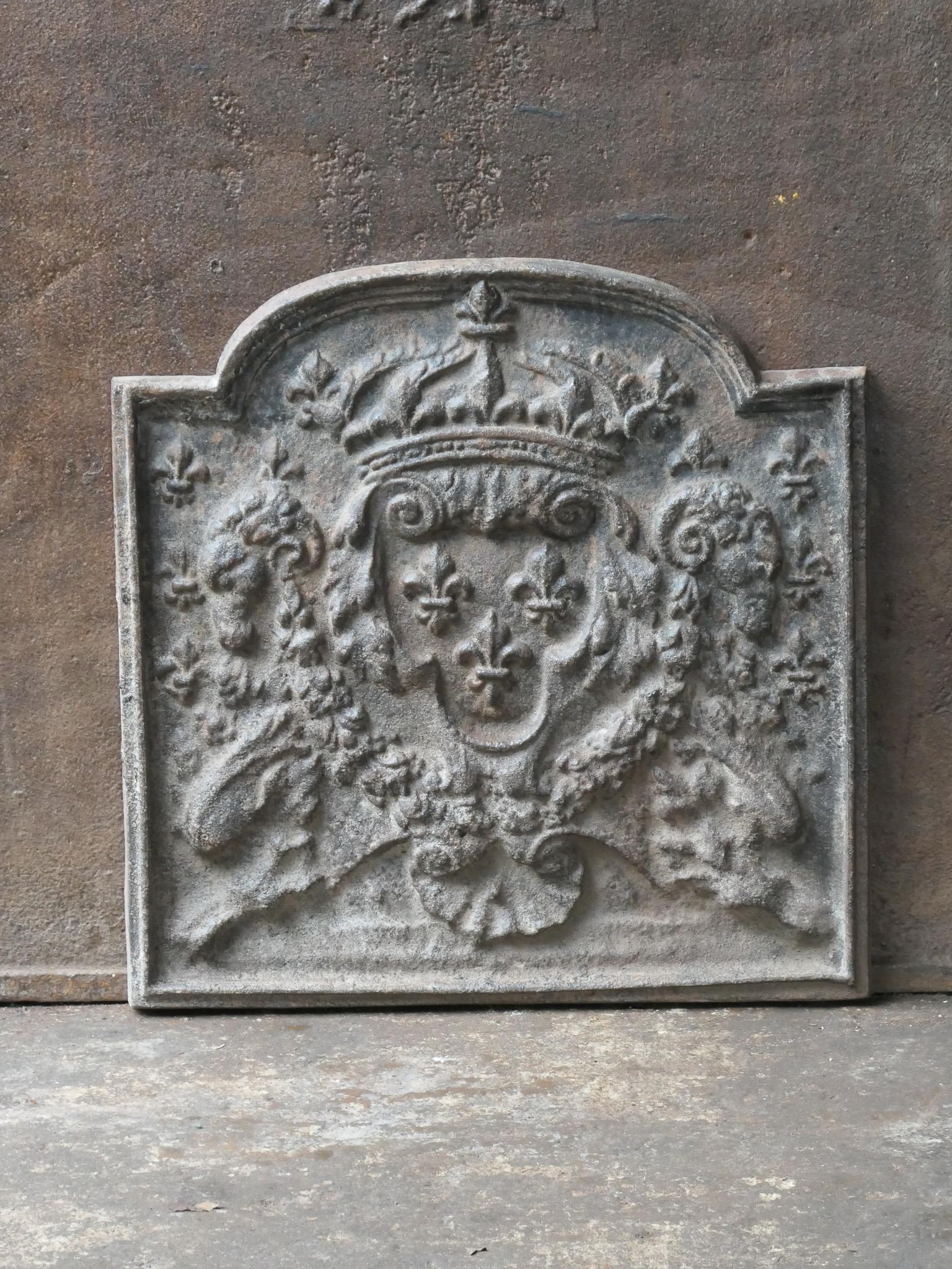 20th century French Louis XIV style fireback with the Arms of France. A coat of arms of the House of Bourbon, an originally French royal house that became a major dynasty in Europe. The house delivered kings for Spain (Navarra), France, both
