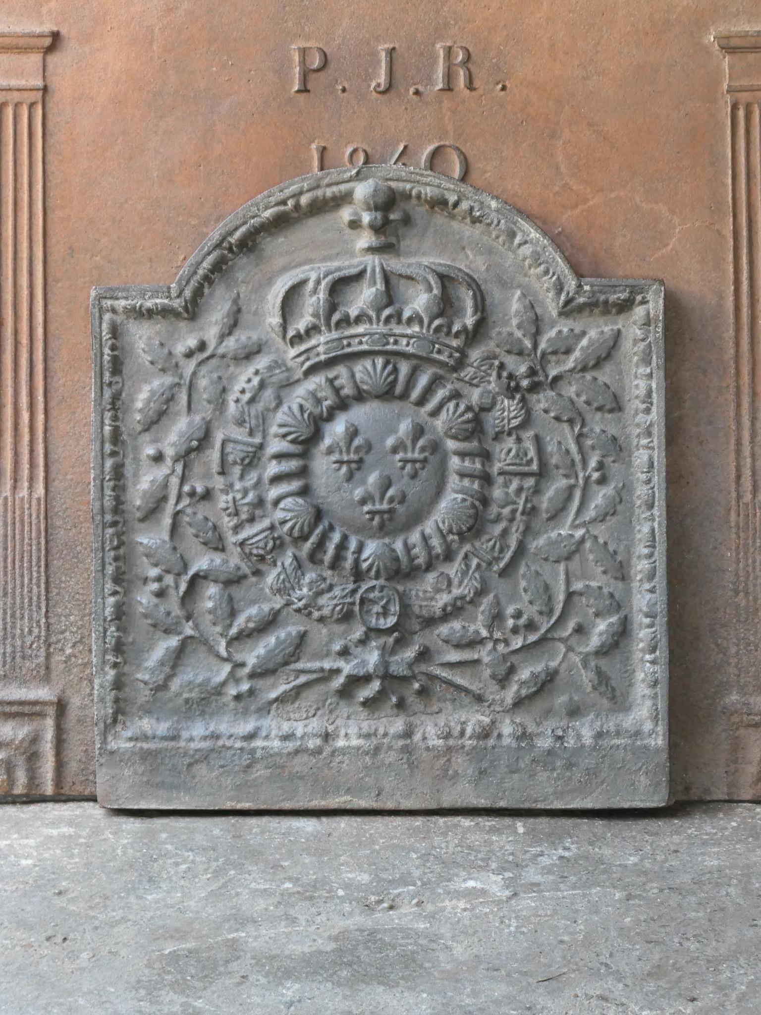 20th century French Louis XIV style fireback with the Arms of France. A coat of arms of the House of Bourbon, an originally French royal house that became a major dynasty in Europe. The house delivered kings for Spain (Navarra), France, both