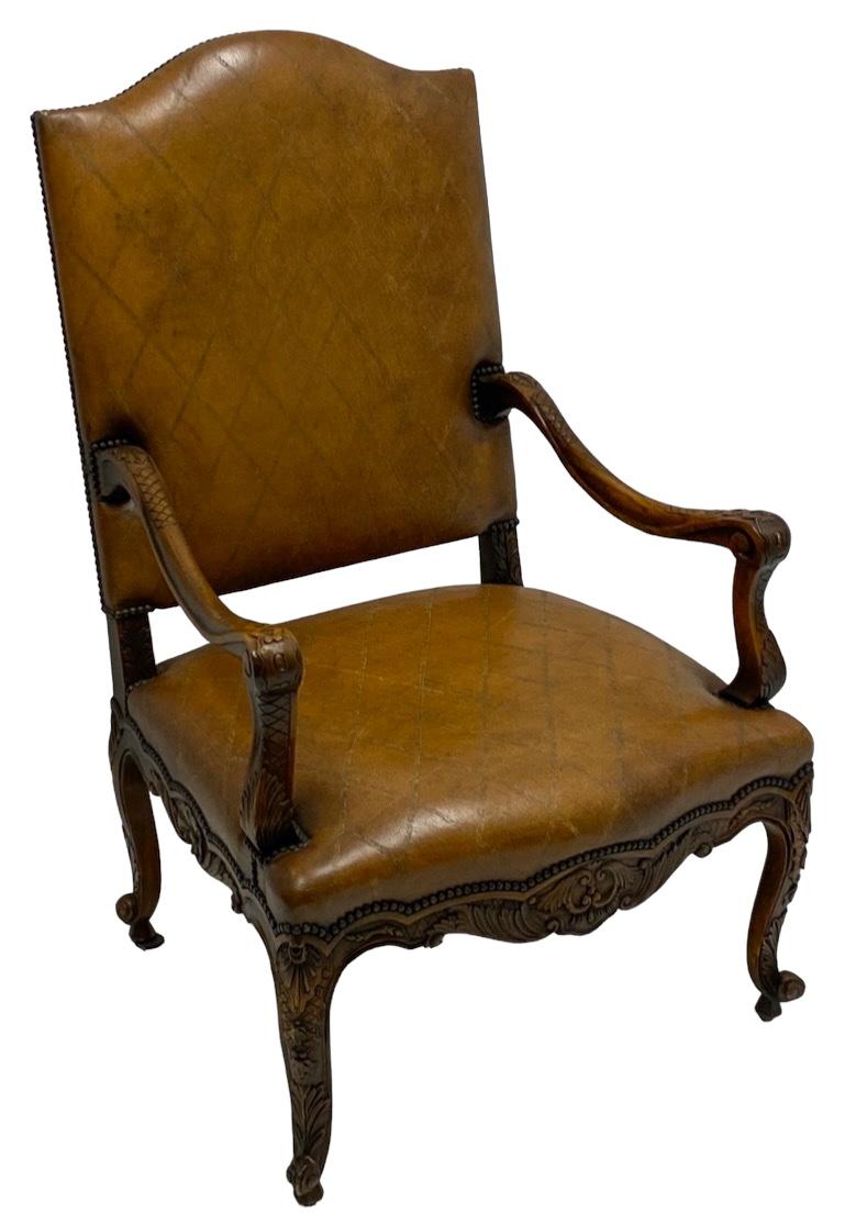 This is a large scale French Louis XIV style bergere in a tooled saddle leather. The frame is a very detailed carved fruitwood. Note the tooled diamond formation on the chair back. It is unmarked and in very good condition.

My shipping is for the