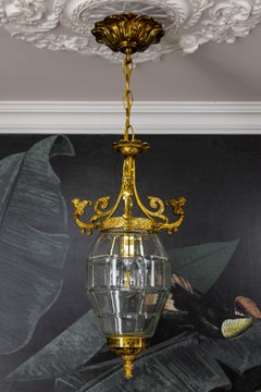French Louis XIV Style Clear Cut Glass, Bronze and Brass Lantern with Cherubs