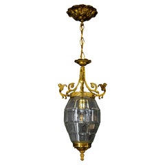 French Louis XIV Style Clear Cut Glass, Bronze and Brass Lantern with Cherubs
