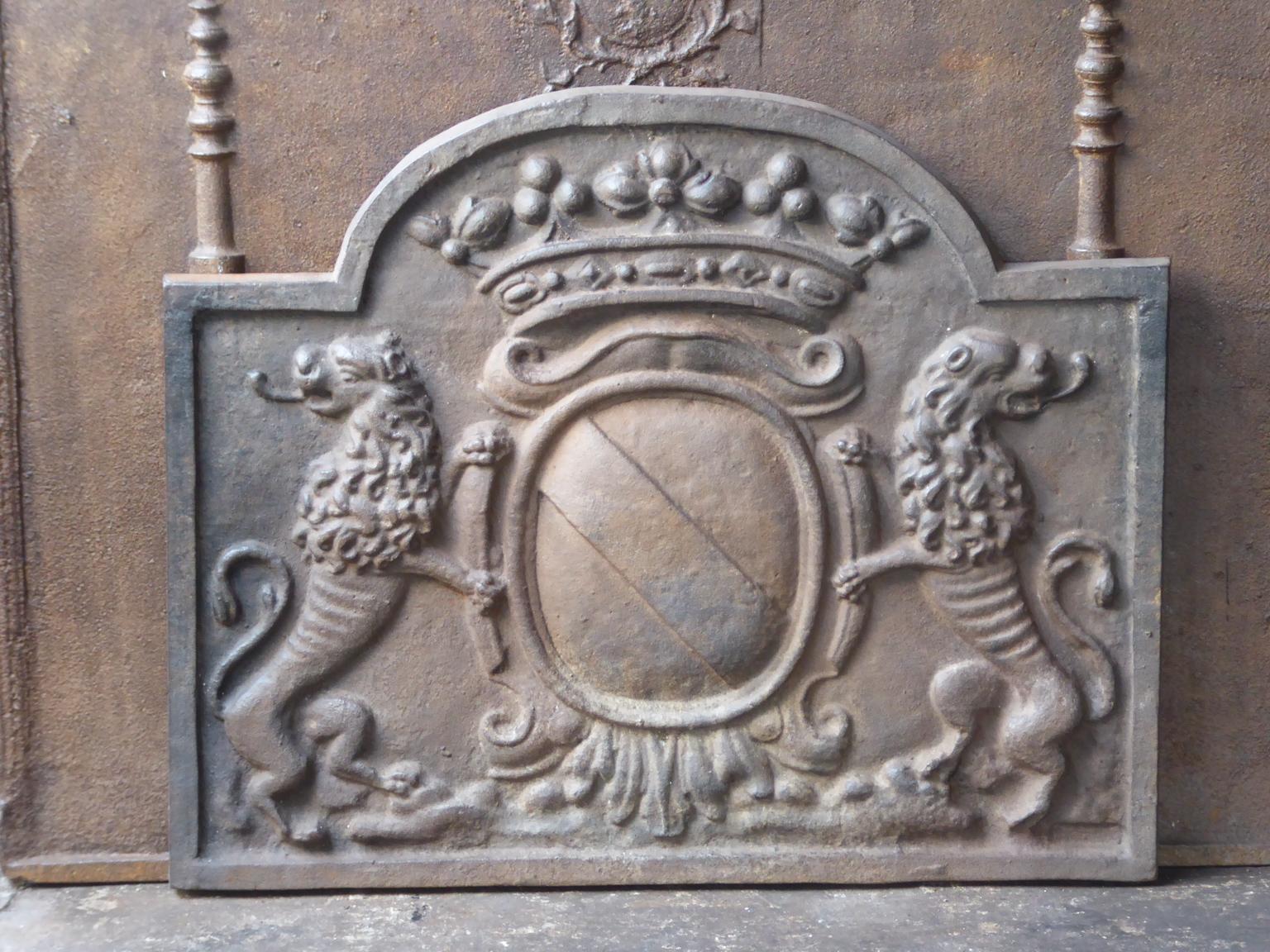 French Louis XIV style fireback with a coat of arms. The fireback is made of cast iron and has a natural brown patina. Upon request it can be made black / pewter. It is in a good condition and does not have cracks.







 