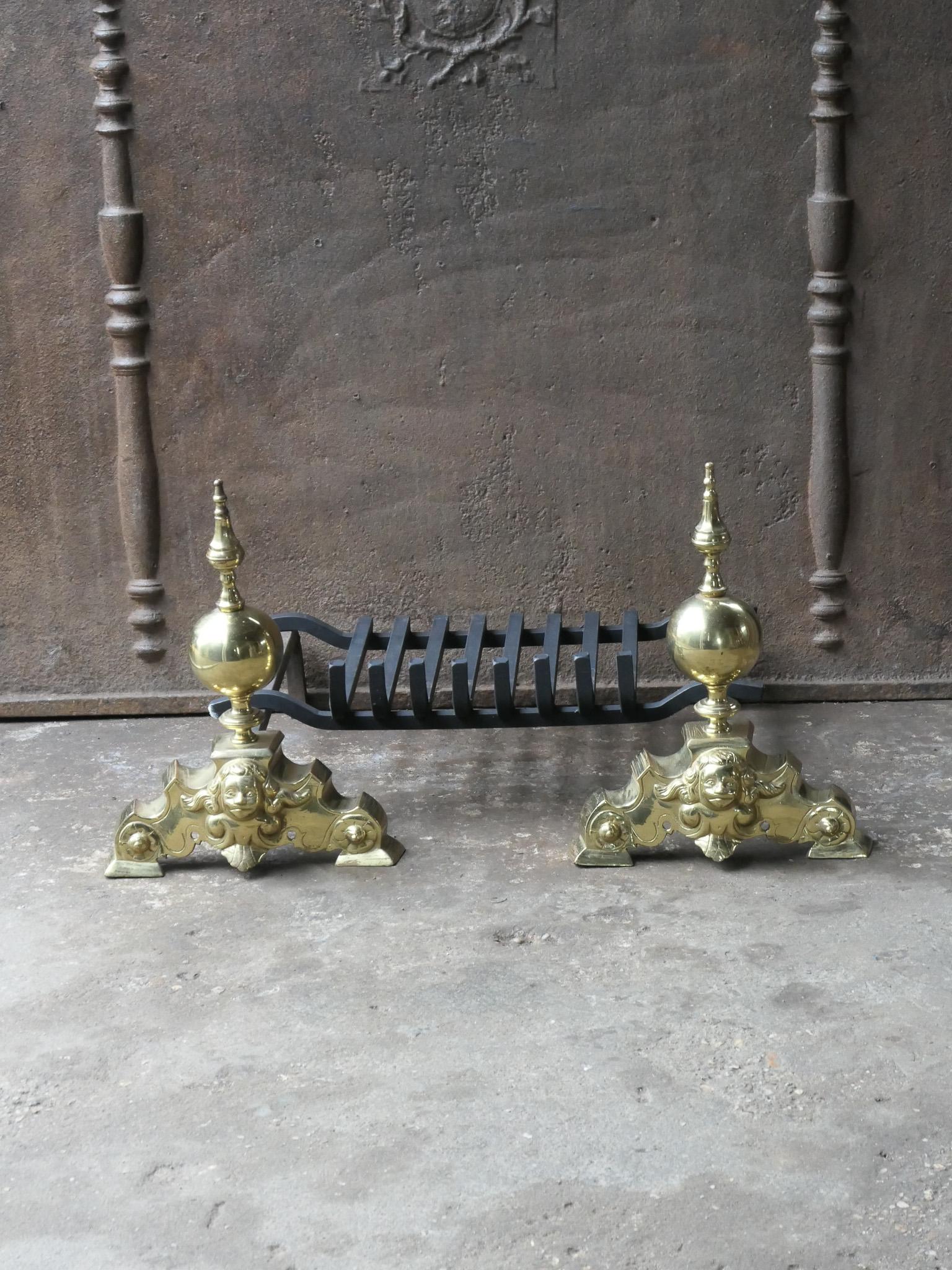 20th century French Louis XIV style fireplace basket - fire basket made of brass and wrought iron. The total width of the front is 27.8 inch (70.5 cm)

The basket is in a good condition and is fully functional.