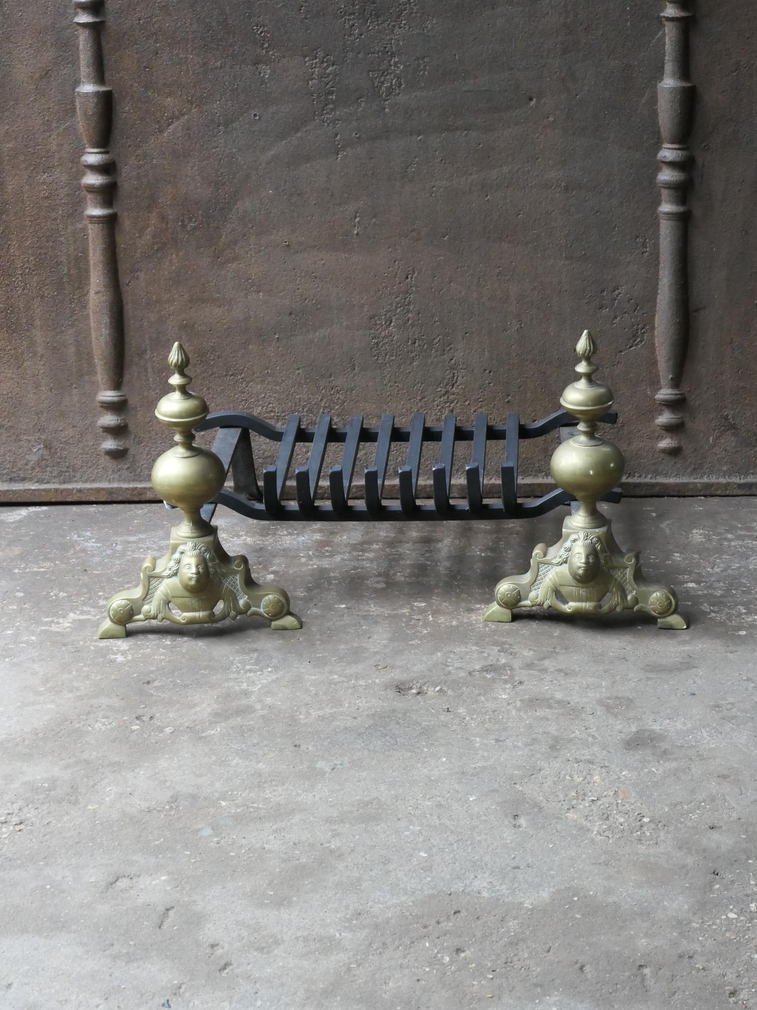 19th - 20th century French Louis XIV style fireplace basket - fire basket made of brass and wrought iron. The total width of the front is 27.8 inch (70.5 cm)

The basket is in a good condition and is fully functional.