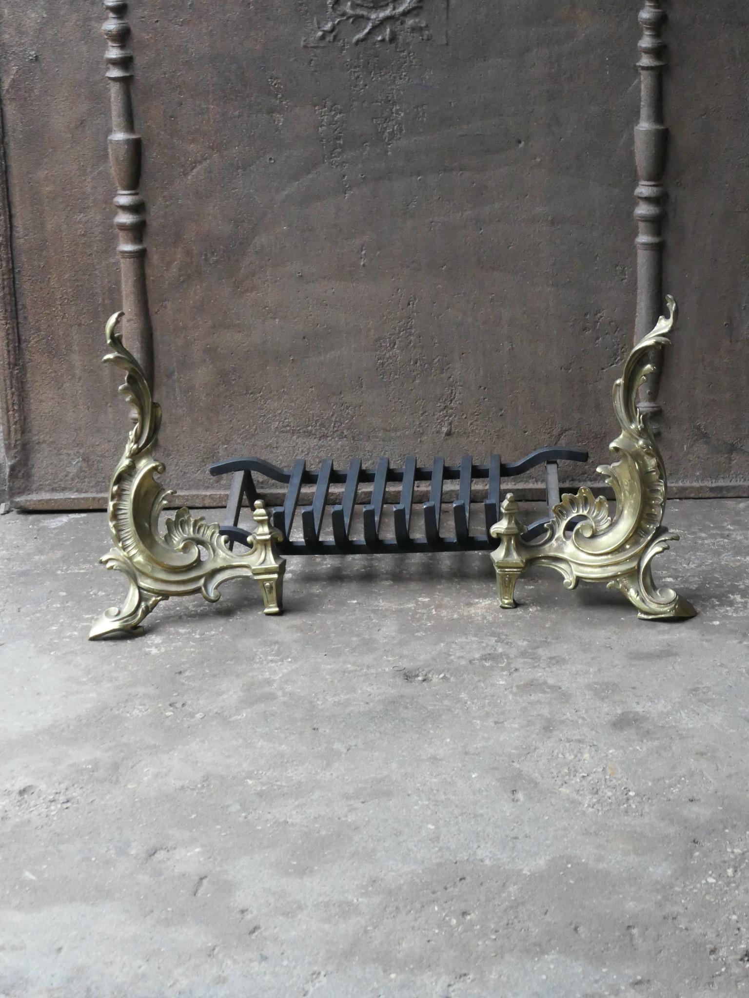 20th century French Louis XIV style fireplace basket - fire basket made of brass and wrought iron. The total width of the front is 30.7 inch (78.0 cm)

The basket is in a good condition and is fully functional.