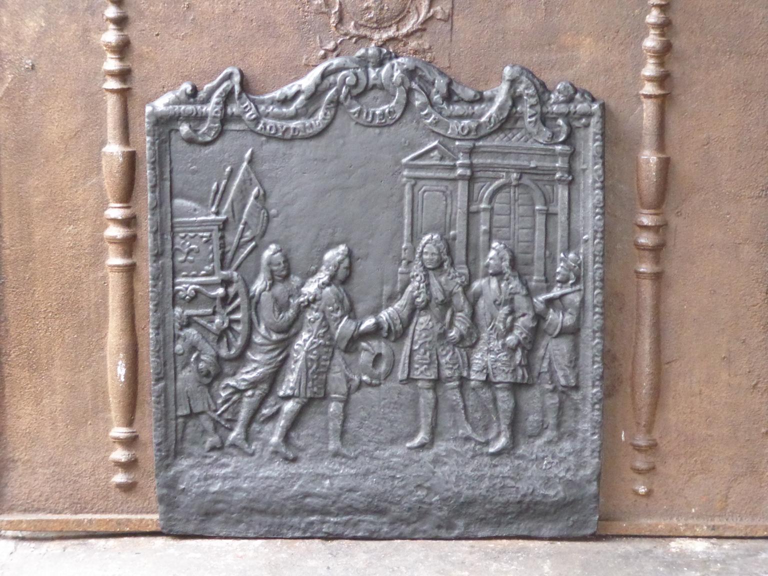 20th century French Louis XIV style fireback with the inscription: ''L'adieu du roy d'Espagne avec le roy de France''. Louis XIV says farewell to his grandson Philippe V, who has been freshly elected king of Spain with the words: 'My son, there are