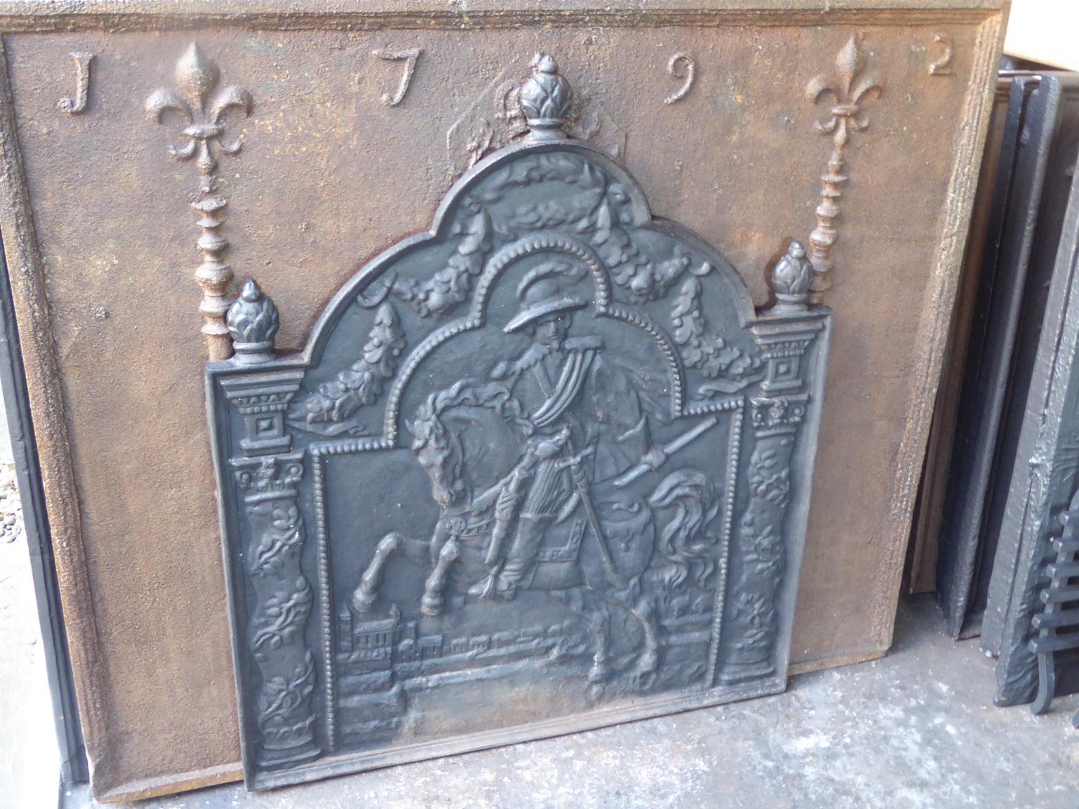 20th century French Louis XIV style fireback with the inscription: ''L'adieu du roy d'Espagne avec le roy de France''. Louis XIV says farewell to his grandson Philippe V, who has been freshly elected king of Spain with the words: 'My son, there are