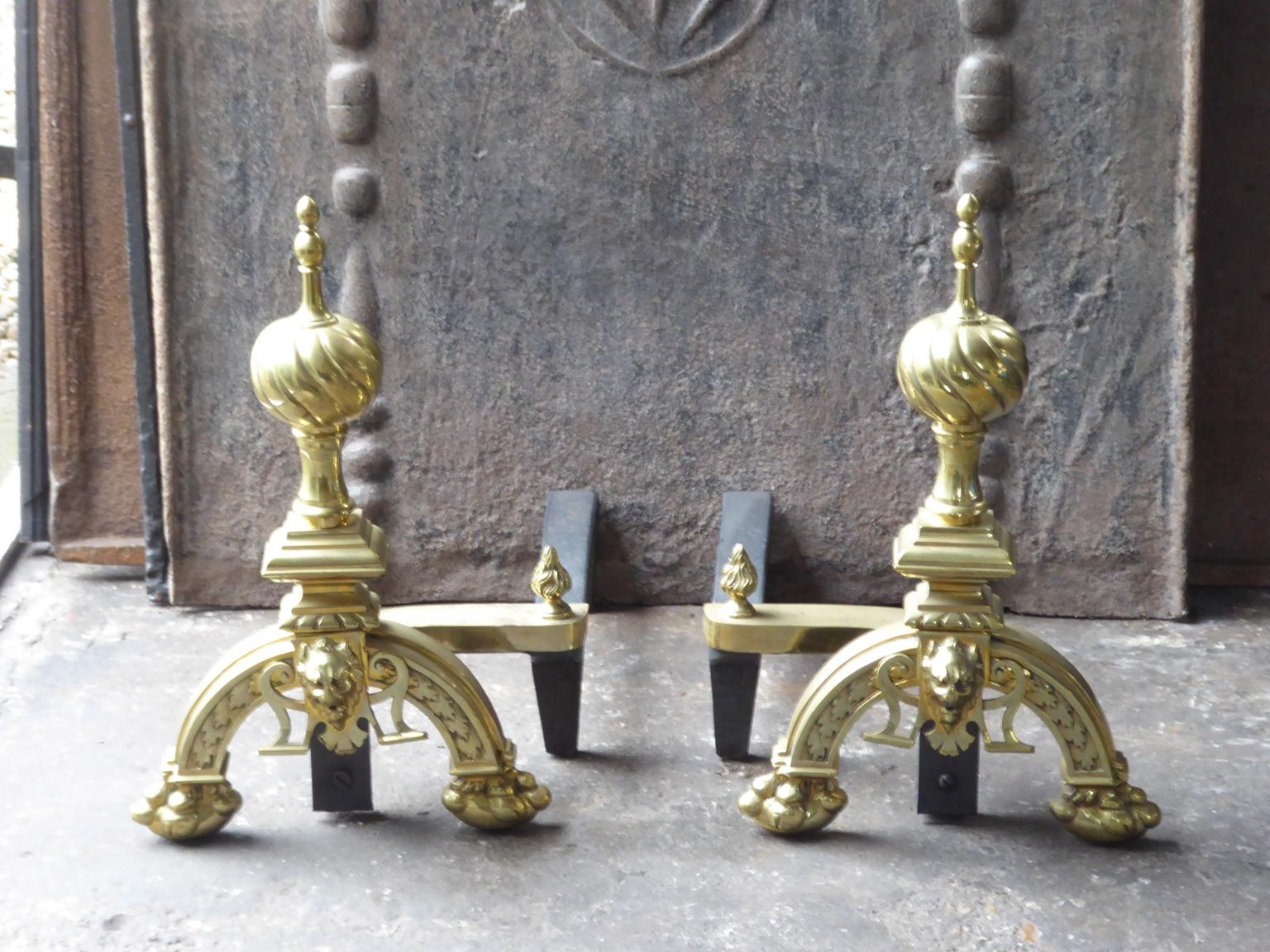 French Louis XIV style andirons made of polished brass and cast iron.







  