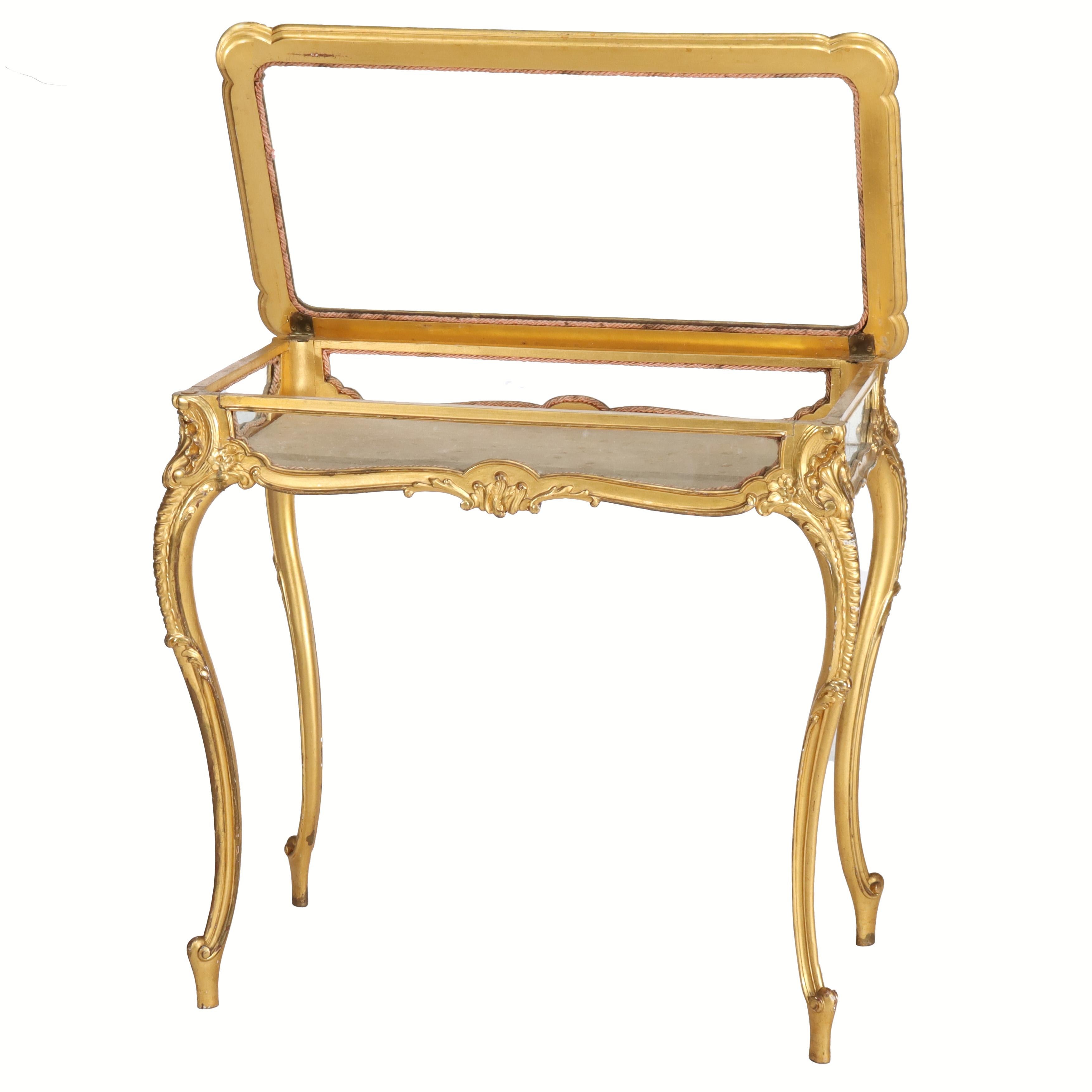 ***Reduced In-House Delivery Rates - Click on “Ask Seller” to Request a Quote***
French Louis XIV Style Giltwood Flip Top Display Vitrine C1930.    
Measures - 30.25