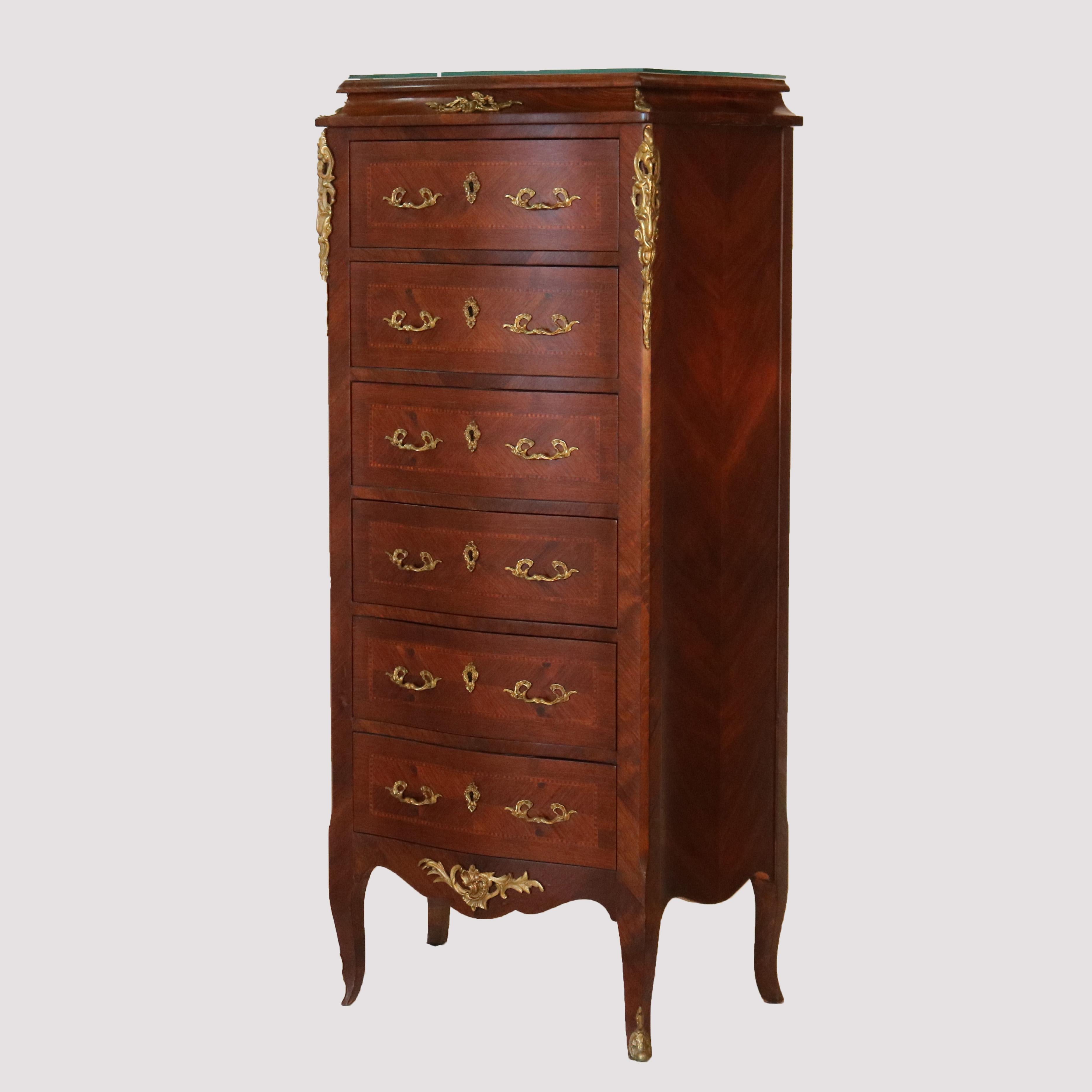A French Louis XIV lingerie style (reproduction) chest offers kingwood construction with six drawers having bookmatched facing with satinwood banding, foliate cast pulls and mounts throughout, raised on cabriole legs, late 20th century.

Measures -