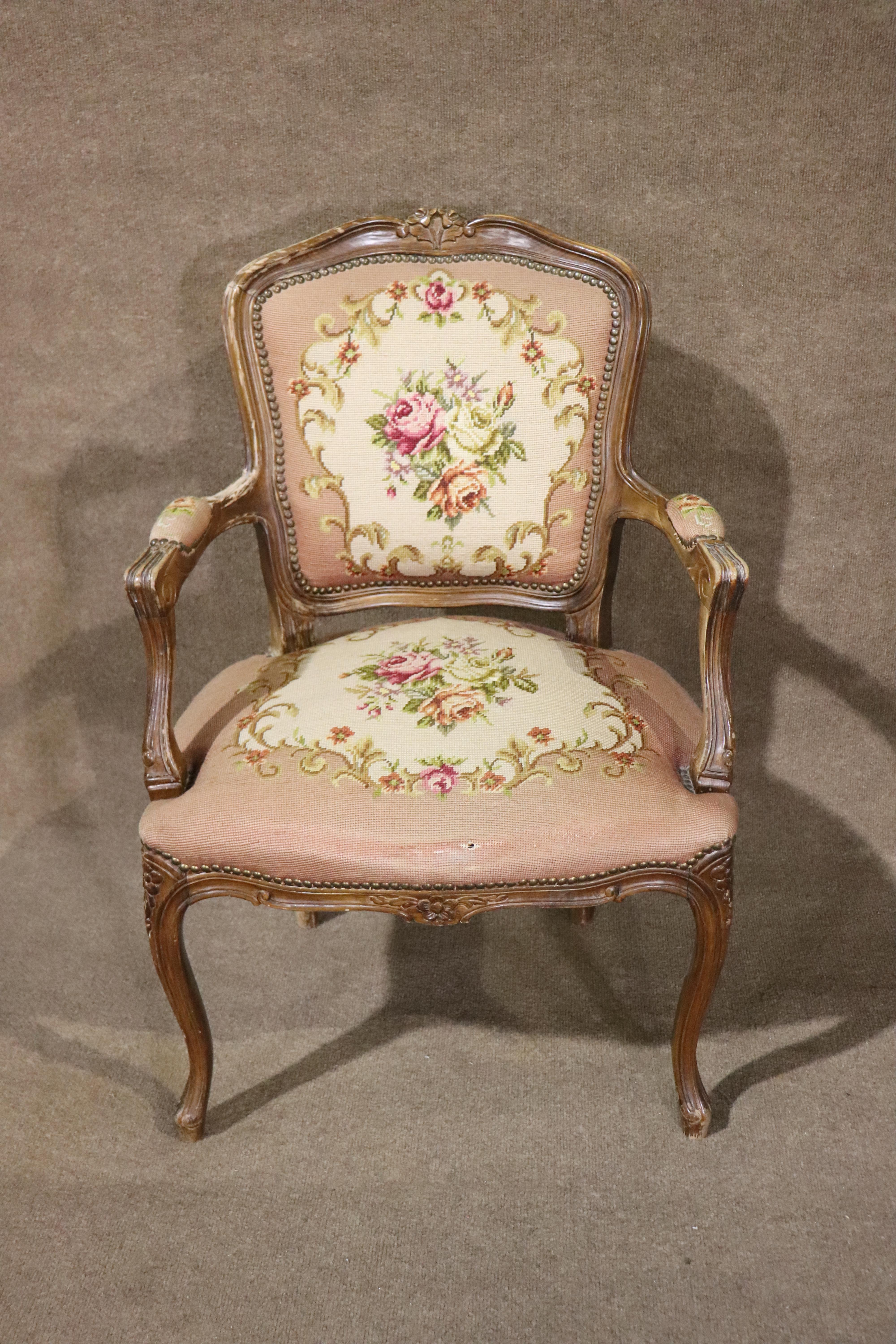 Antique side chair with beautiful needlepoint design on seat, back and arms. Hand carved frame with decorative design and nail head trim.
Please confirm location NY or NJ 