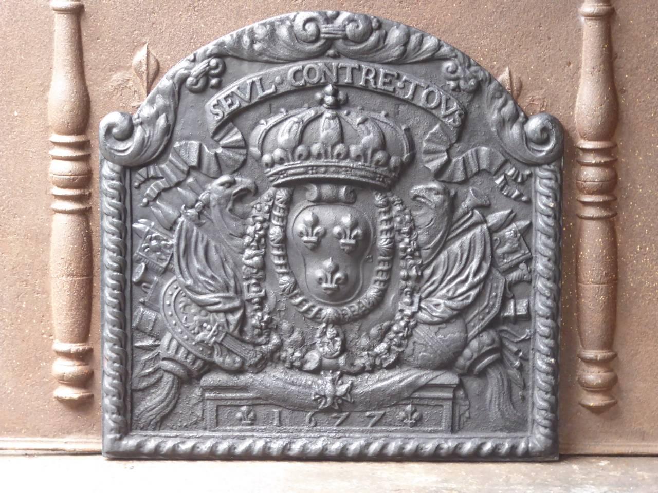 French Louis XIV style 'Seul contre Tous' Fireback. Reminder plate that says 'Seul contre Tous', or 'All Against One'. It symbolizes the French battle against the European coalition at the end of the 17th century. The coalition tried to restrict the