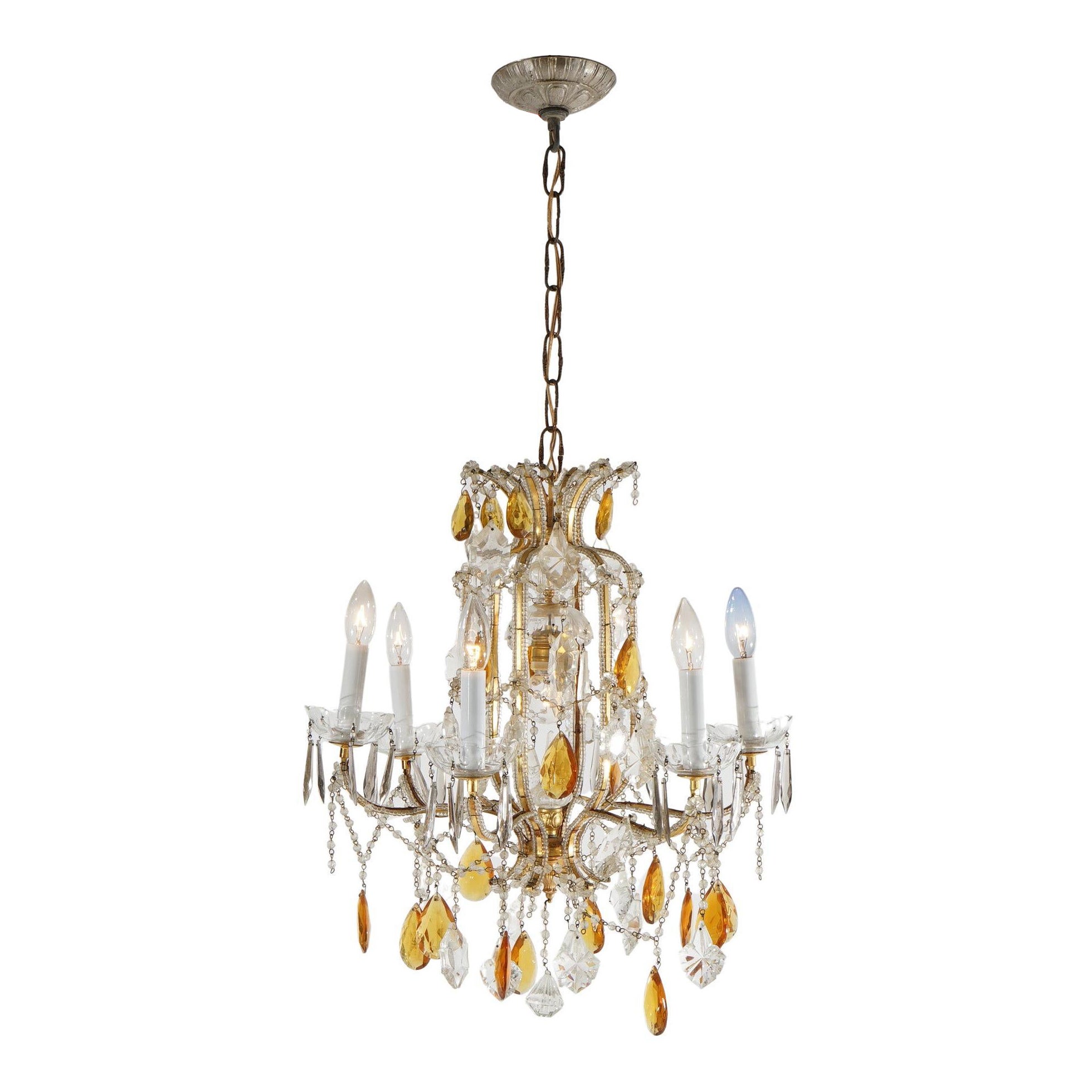 French Louis. Lampadario a sette luci con prismi d
ambra in stile XIV, XX sec. in vendita