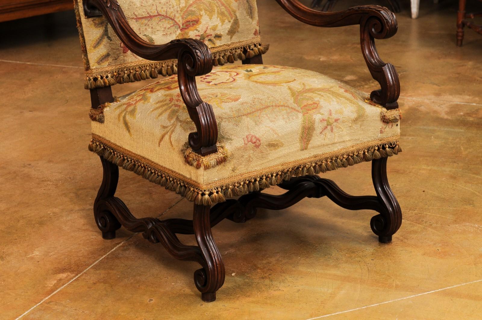 19th Century French Louis XIV Style Walnut Fauteuil with Carved Arms and Scrolling Legs For Sale