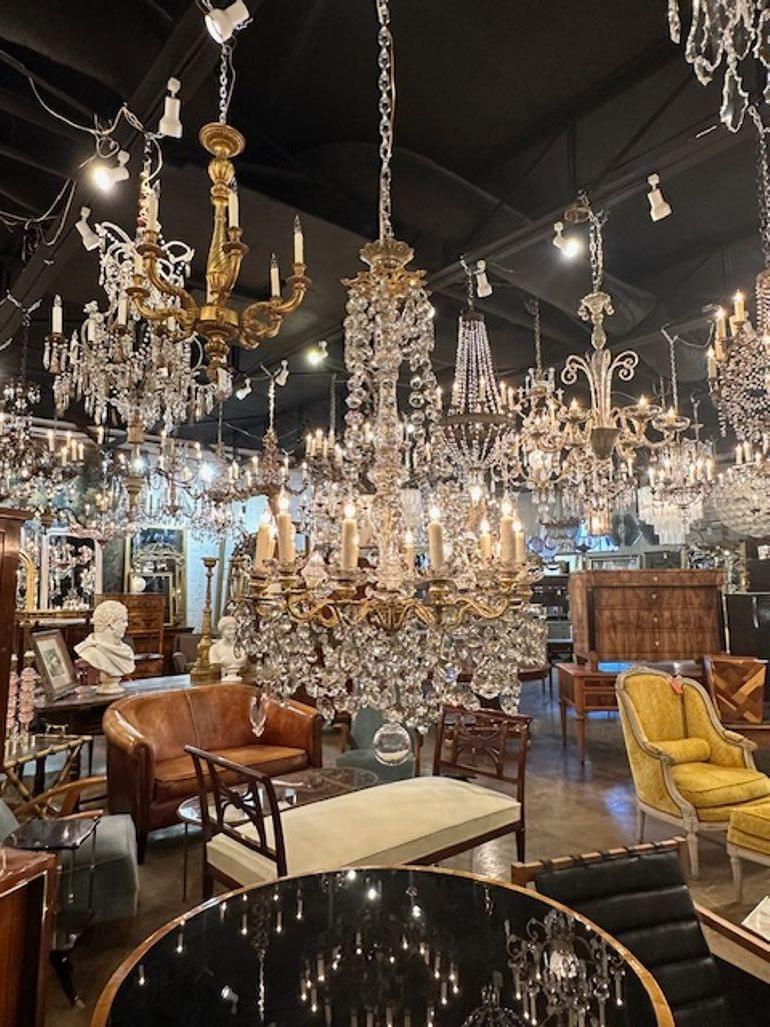 19th century French Louis XV style gilt bronze and crystal 12-light chandelier. Circa 1870. The chandelier has been professionally rewired, comes with matching chain and canopy. It is ready to hang!