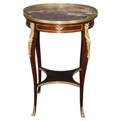 Tavola rotonda in mogano con piano in marmo, epoca Luigi XV, 1870, montata su bronzo, di Millet