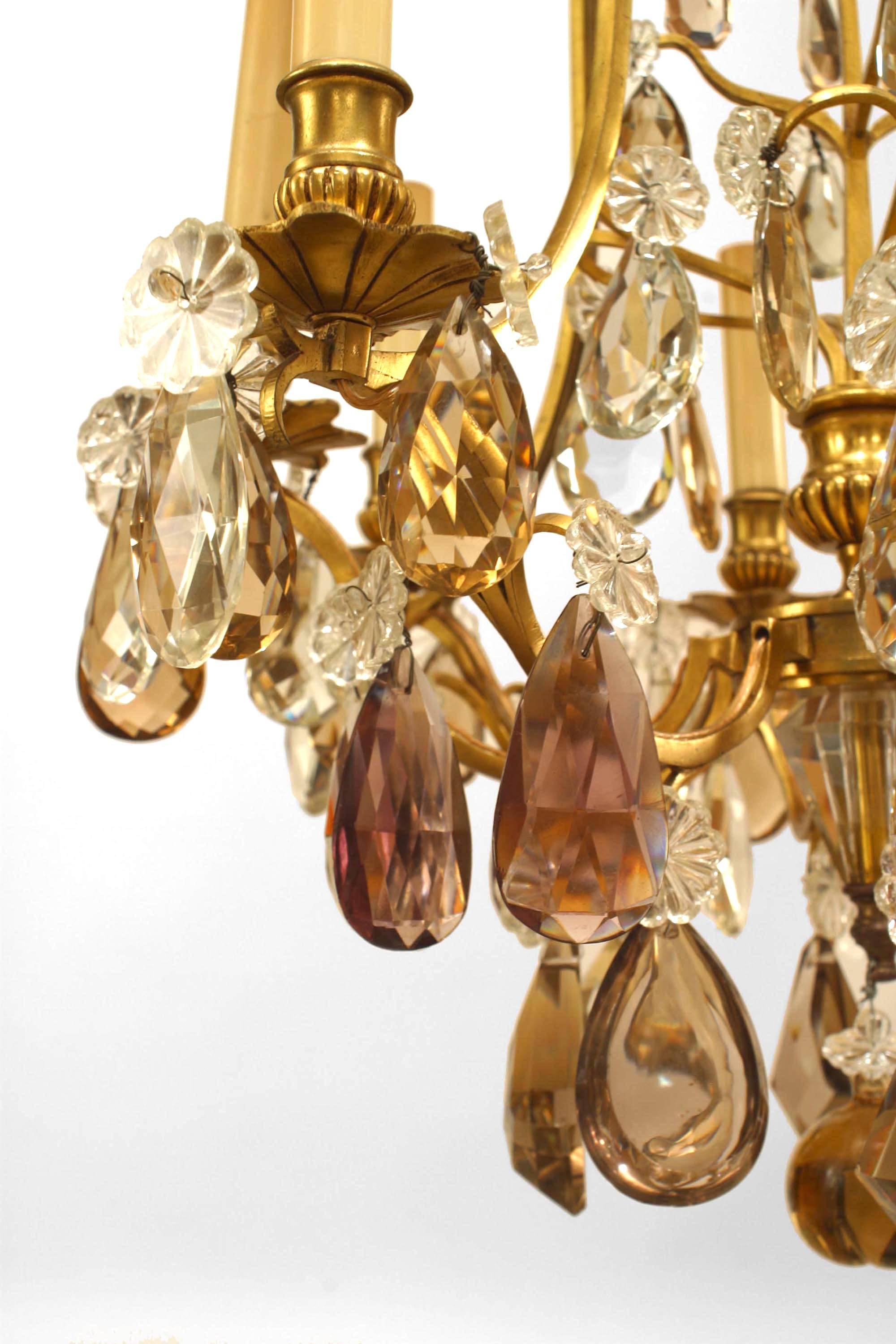French Louis XV '19th-20th Century' gilt bronze eight-light chandelier with amethyst and amber shaped crystal drops.
 