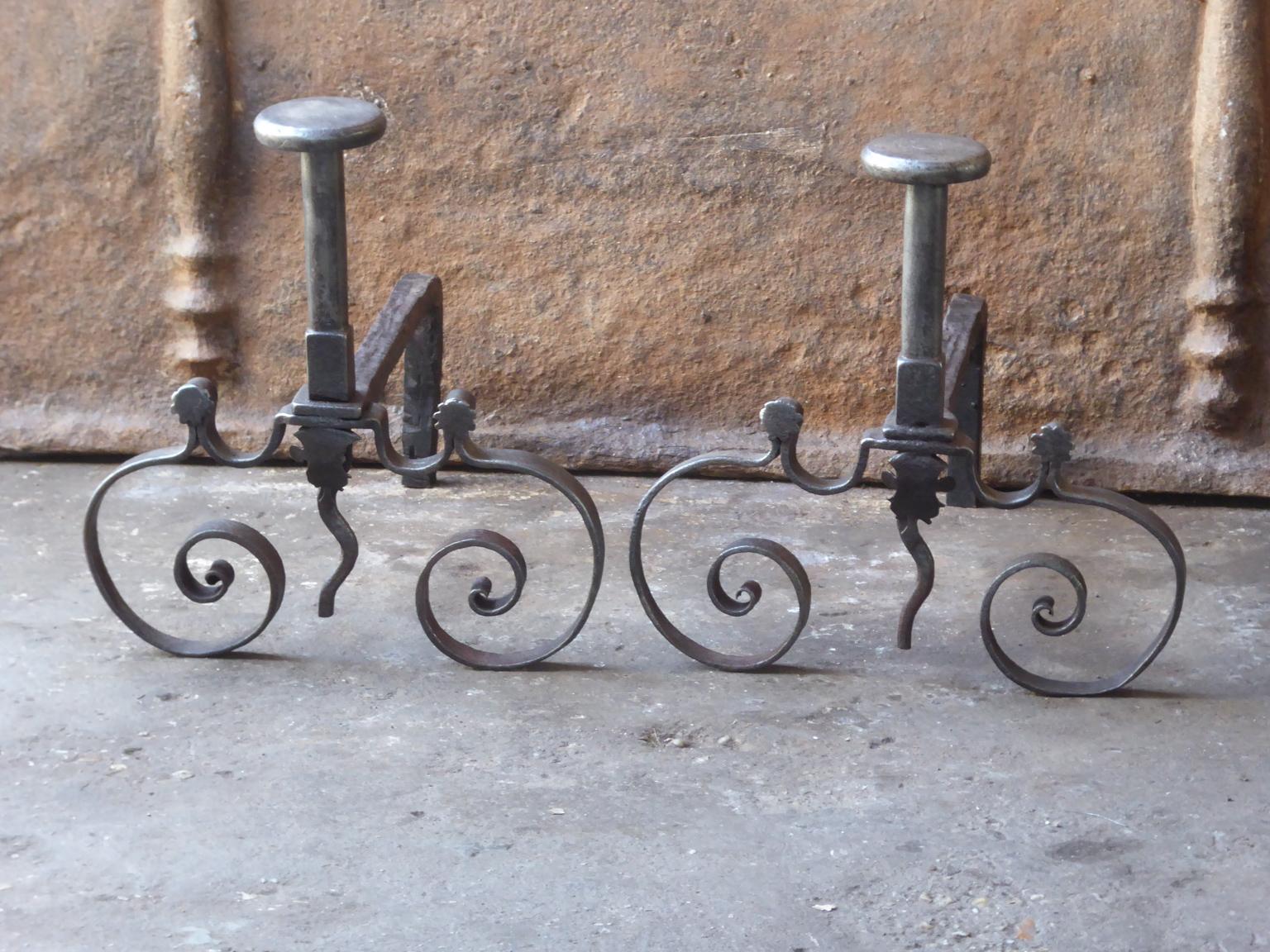 18th century French andirons made of wrought iron. The style of the andirons is Louis XV and they are from that period. They are in a good condition.