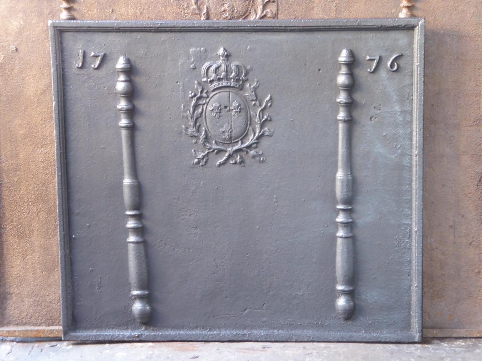 Beautiful 18th century French Louis XV fireback with the arms of France. The Arms of France are flanked by two Pillars of Hercules, which symbolize strength and the unknown. The date of production of the fireback, 1776, is also cast in the