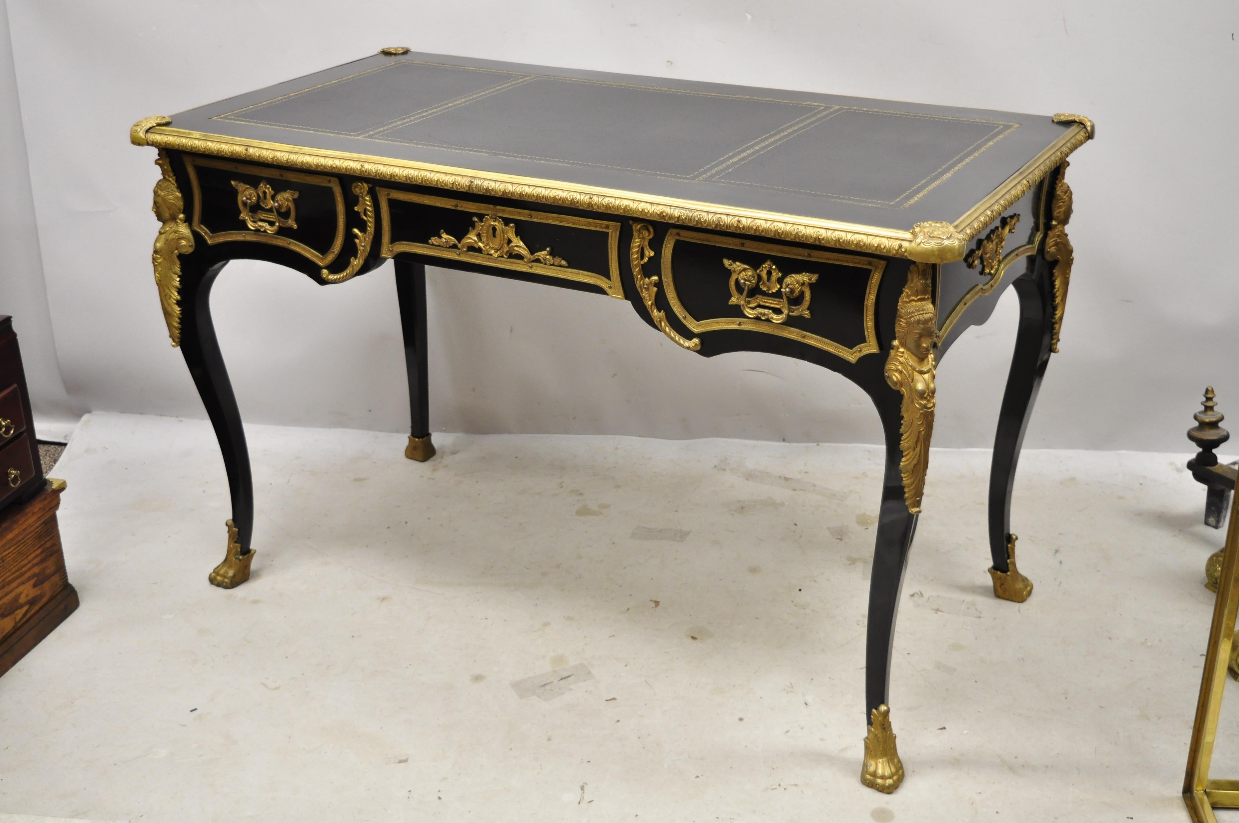 French Louis XV ebonized black lacquer bronze figural Ormolu Bureau plat writing desk. Item features faux 3 drawer finished back (image 10), ornate bronze ormolu, bronze paw feet, 3 panel tooled leather top, bronze ormolu maiden figures to legs,