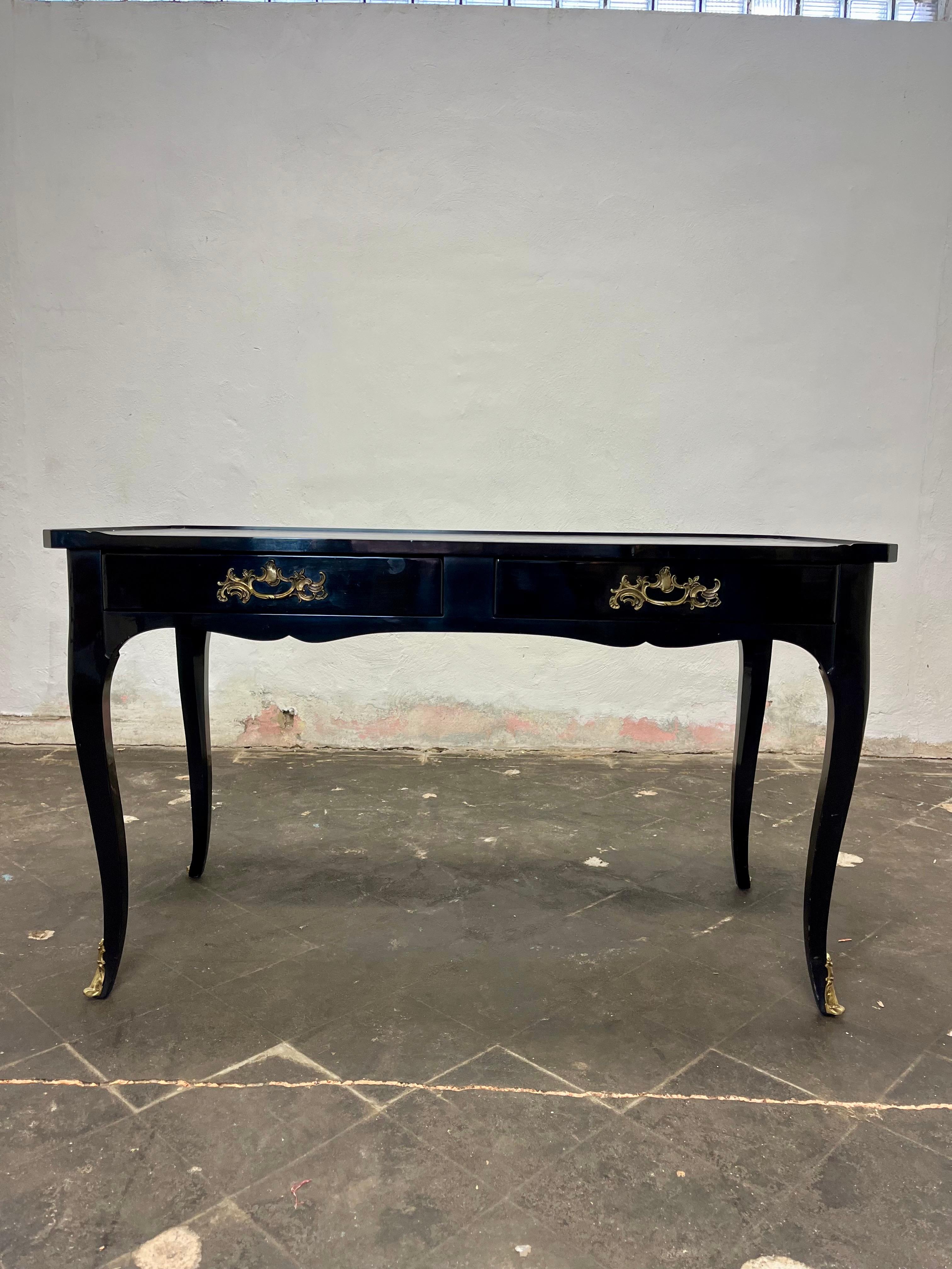This is a handsome French Louis XV style black lacquered / ebonized desk by Jacques Bodart. The desk has a tooled black leather top and bronze appointments. 2 functioning drawers and 2 faux drawers on opposite side.
Curbside to NYC/Philly $400