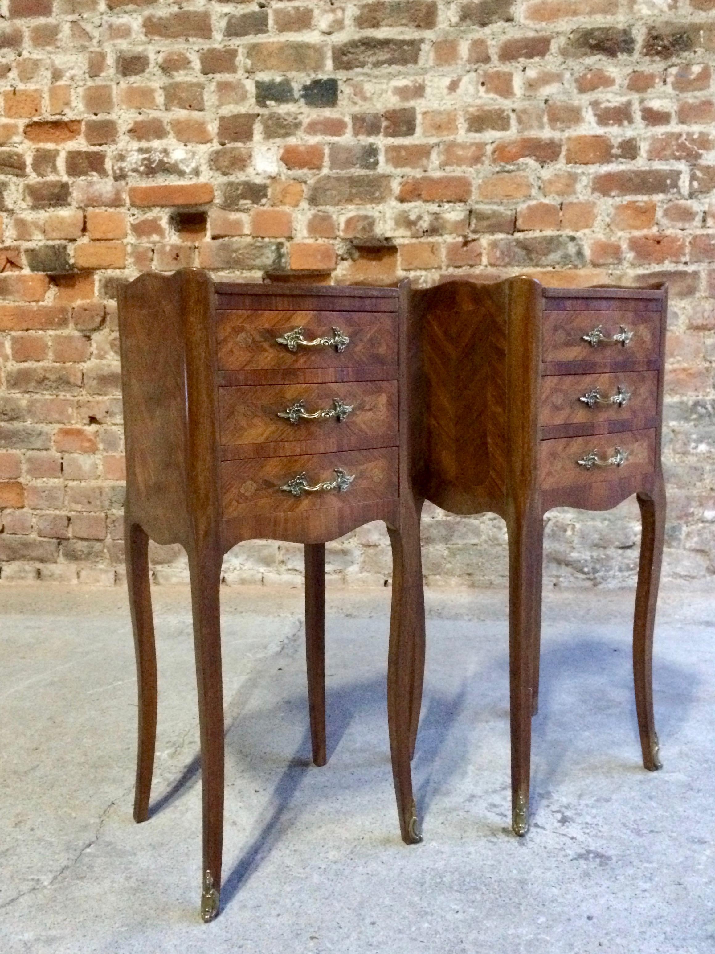 Fabulous Antique French pair of Louis XV style Bombe Commode bedside cabinets circa 1890, the inlaid marquetry tops over three drawers with inlaid flowers and decorations with bronze handles and gilt mounts, bronze accents to the sides and legs, all
