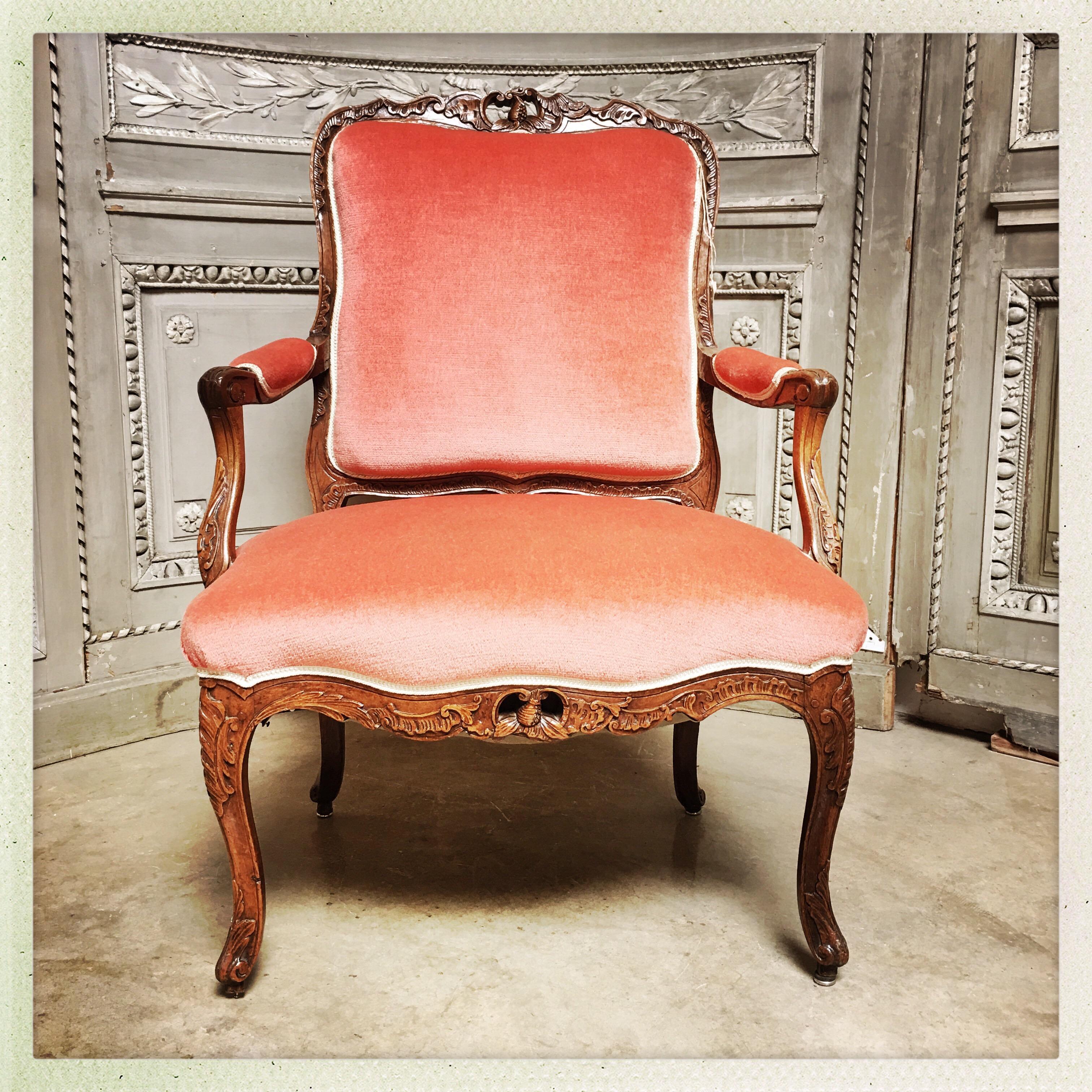 A French Louis XV carved walnut fauteuil from the Provence region of France from the 18th century.
 