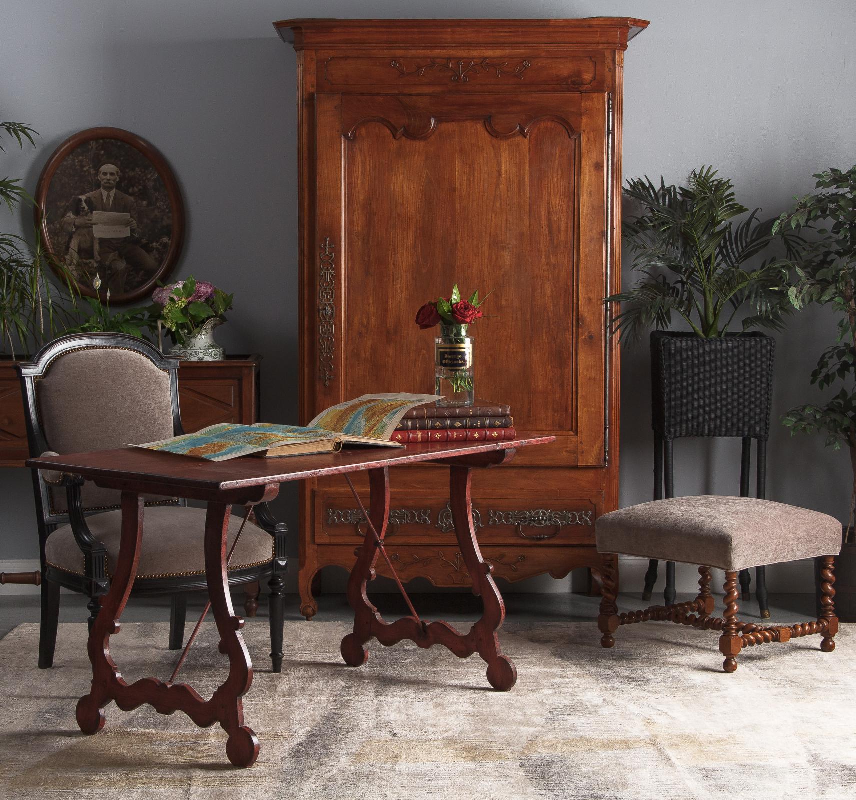 An outstanding cherrywood Louis XV bonnetiere armoire, from the Vendee region of France, circa 18th century. Gorgeous, warm cherrywood construction featuring a single large door that opens to a generous space with two non-adjustable shelves and a