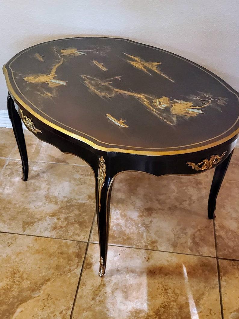 An exceptional French aubergine laqueured gilded bronze ormolu cocktail table attributed to Escalier de Cristal. Paris.

Born in the late 19th / early 20th century, exquisitely hand-crafted by skilled Parisian artisans, exceptionally executed in
