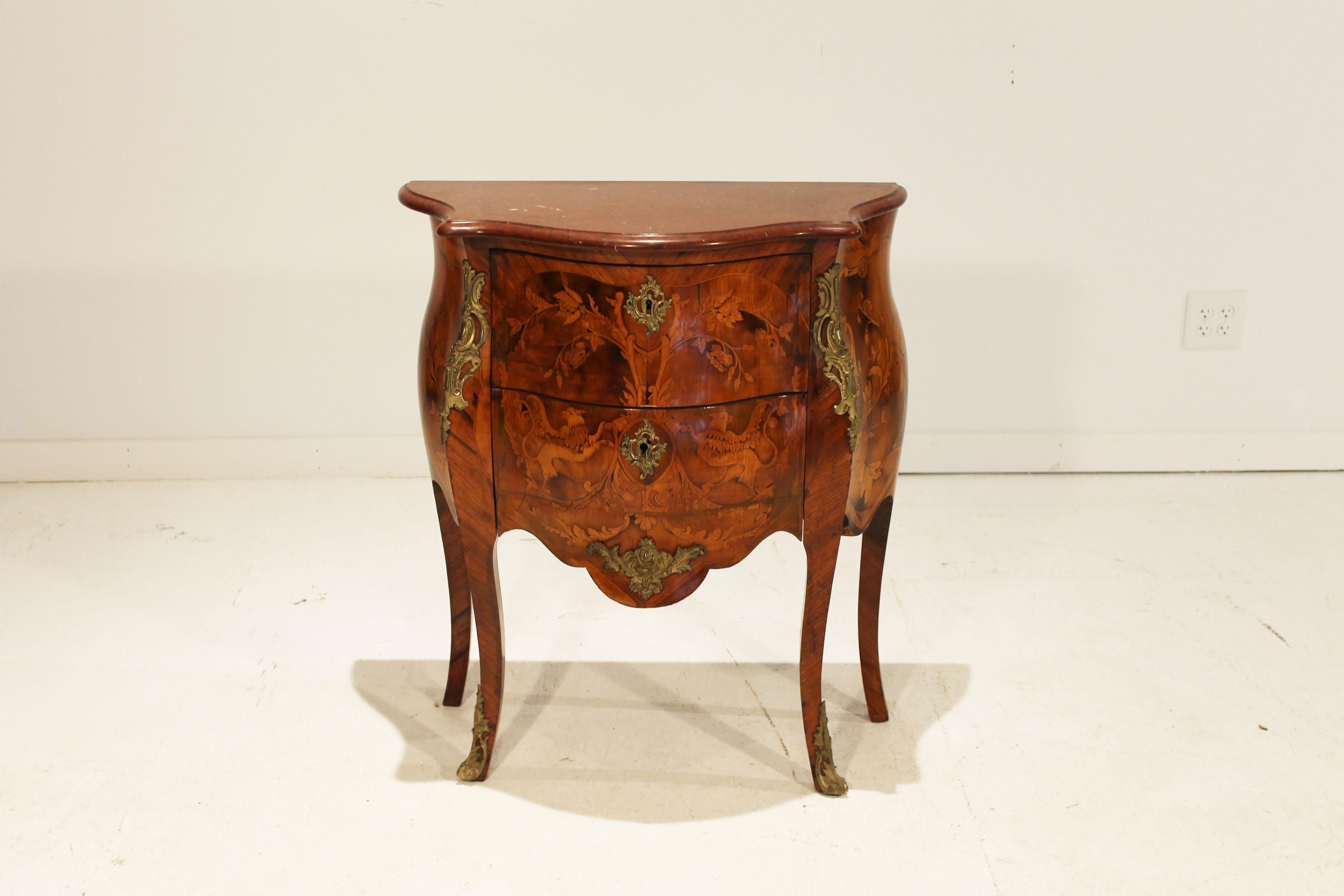 This elegant French Louis XV Belle Époque Marquetry commode is in wonderful condition and would make a gorgeous statement in a bedroom or study. This two drawer commode has exquisite inlay details found in the Louis XV period of furniture design.