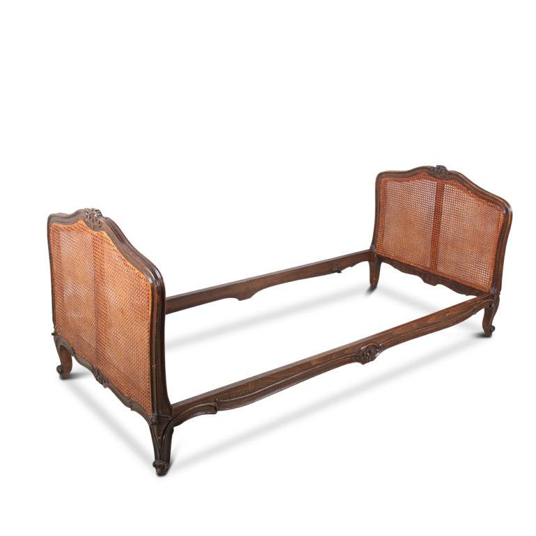 A French, carved beechwood, Louis XV-style daybed with double-caned ends, circa 1930.

Measures: 78.5? wide x 35? deep x 33? tall (at each end).

      
