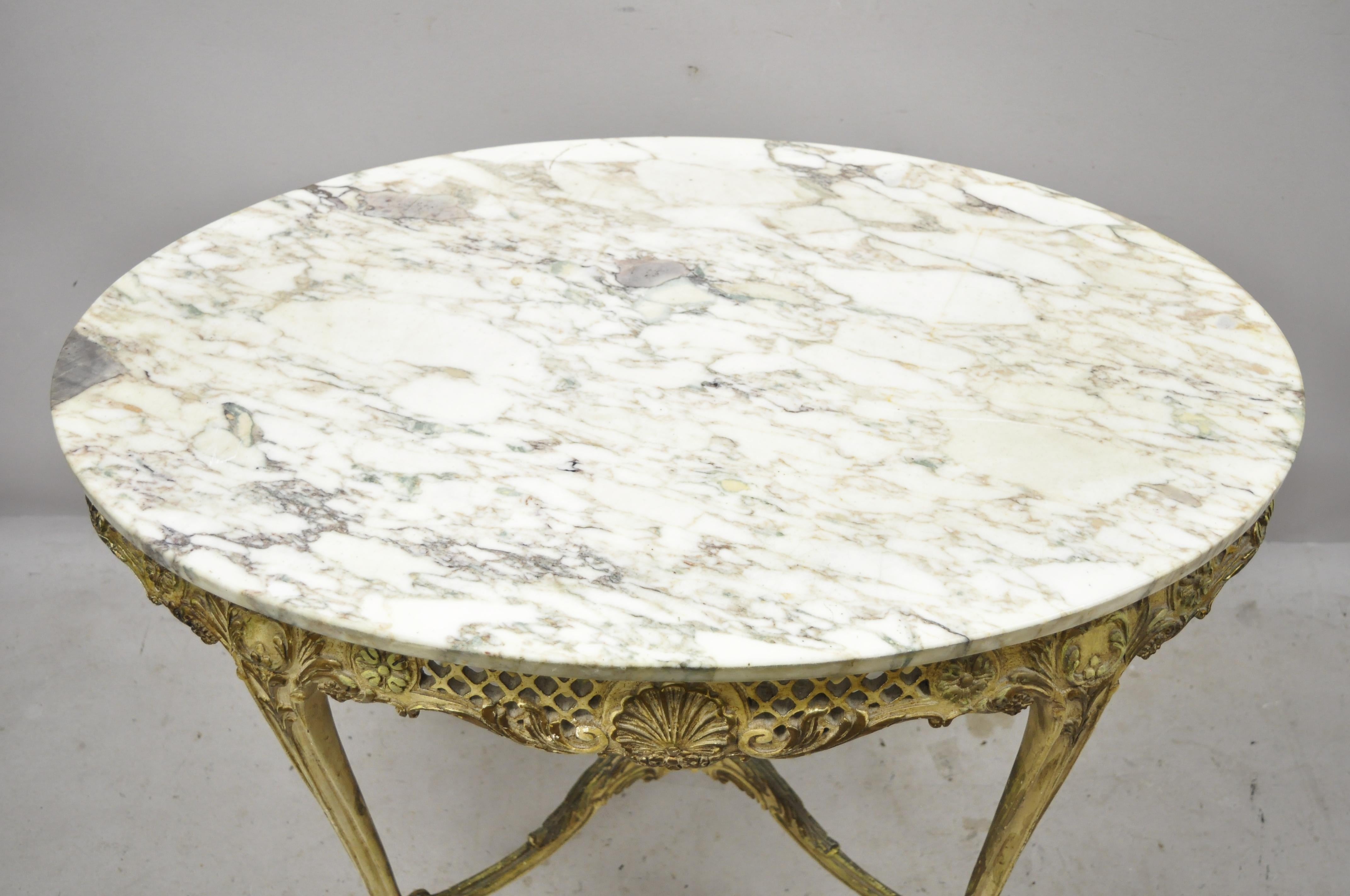 Antique French Louis XV distress painted oval marble top pierce carved parlor accent table. Item features solid carved wood base, oval marble top, pierce carved shell skirt, stretcher base, distressed finish, cabriole legs, very nice antique item.