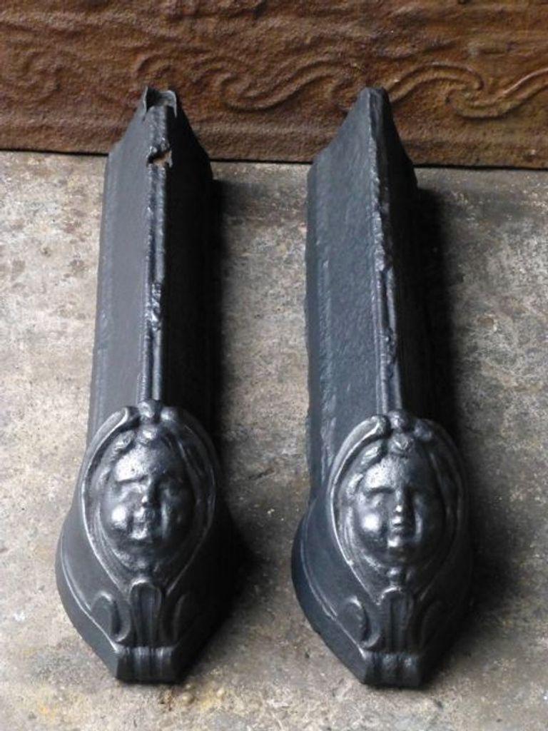 18th Century French Louis XV Period andirons. Made of cast iron. The andirons are in good condition and are fully functional.